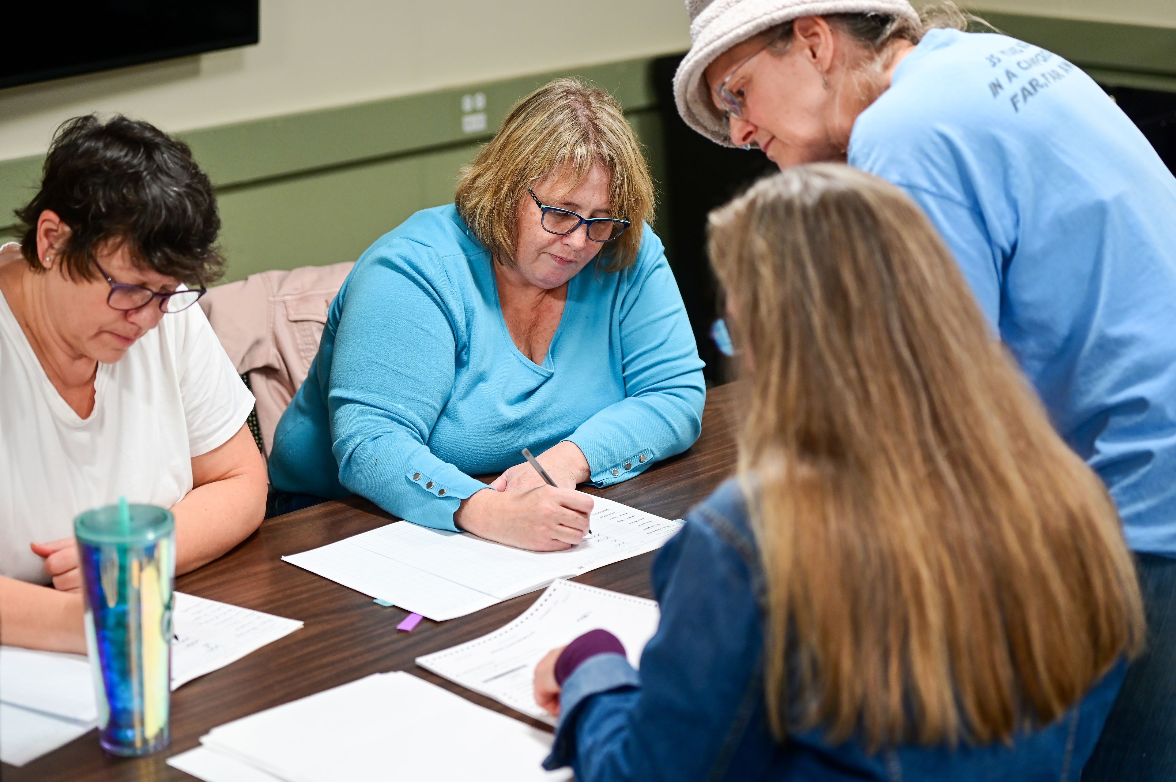 Shelley Nice, from left, Marci Mitchell, Julie Bailey and Karen Hansen work to tally absentee ballots for Latah County Elections in Moscow in the afternoon on Election Day.