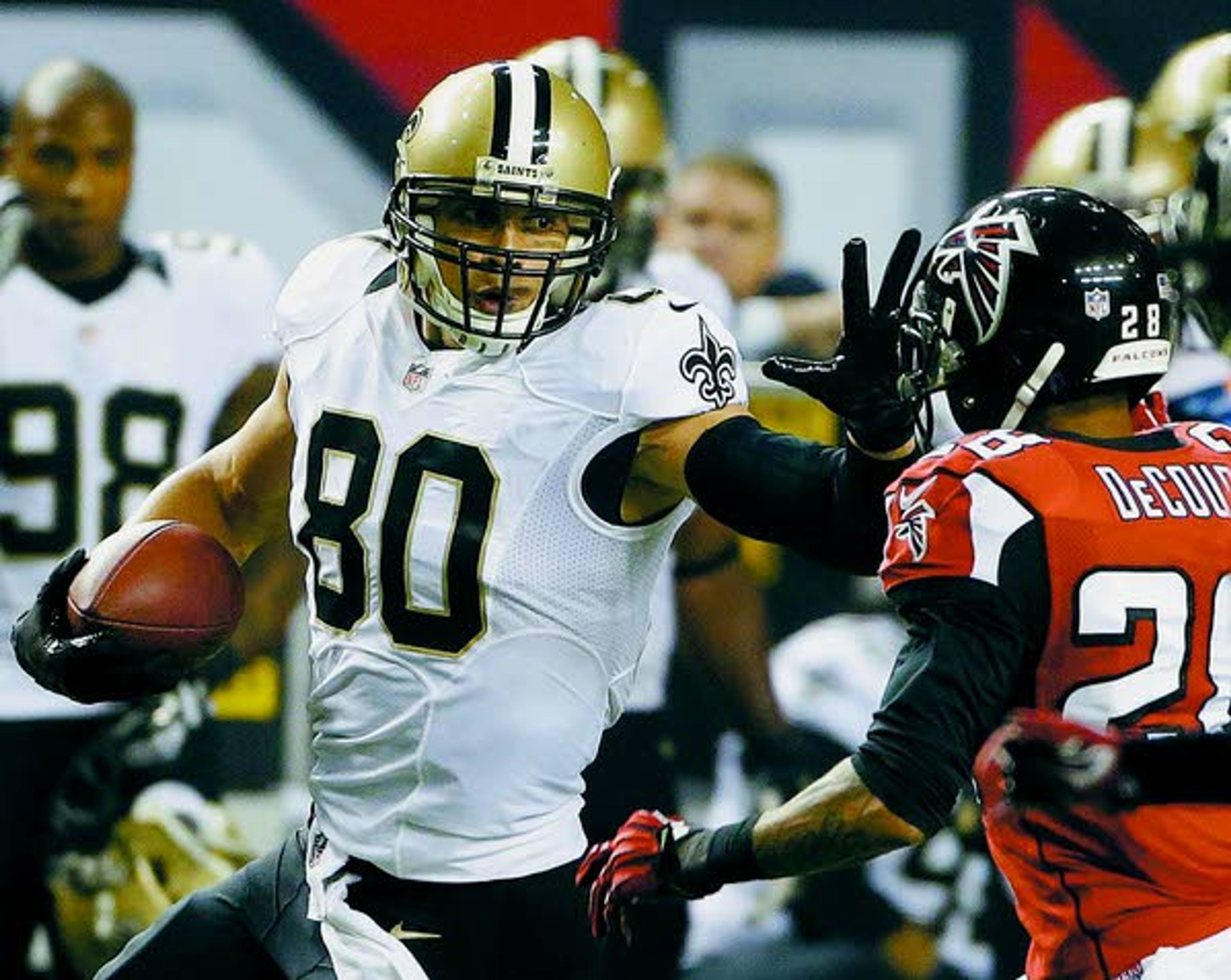 Saints tight end Jimmy Graham (80) shoves Falcons safety Thomas DeCoud (28) during Thursday’s game in Atlanta.