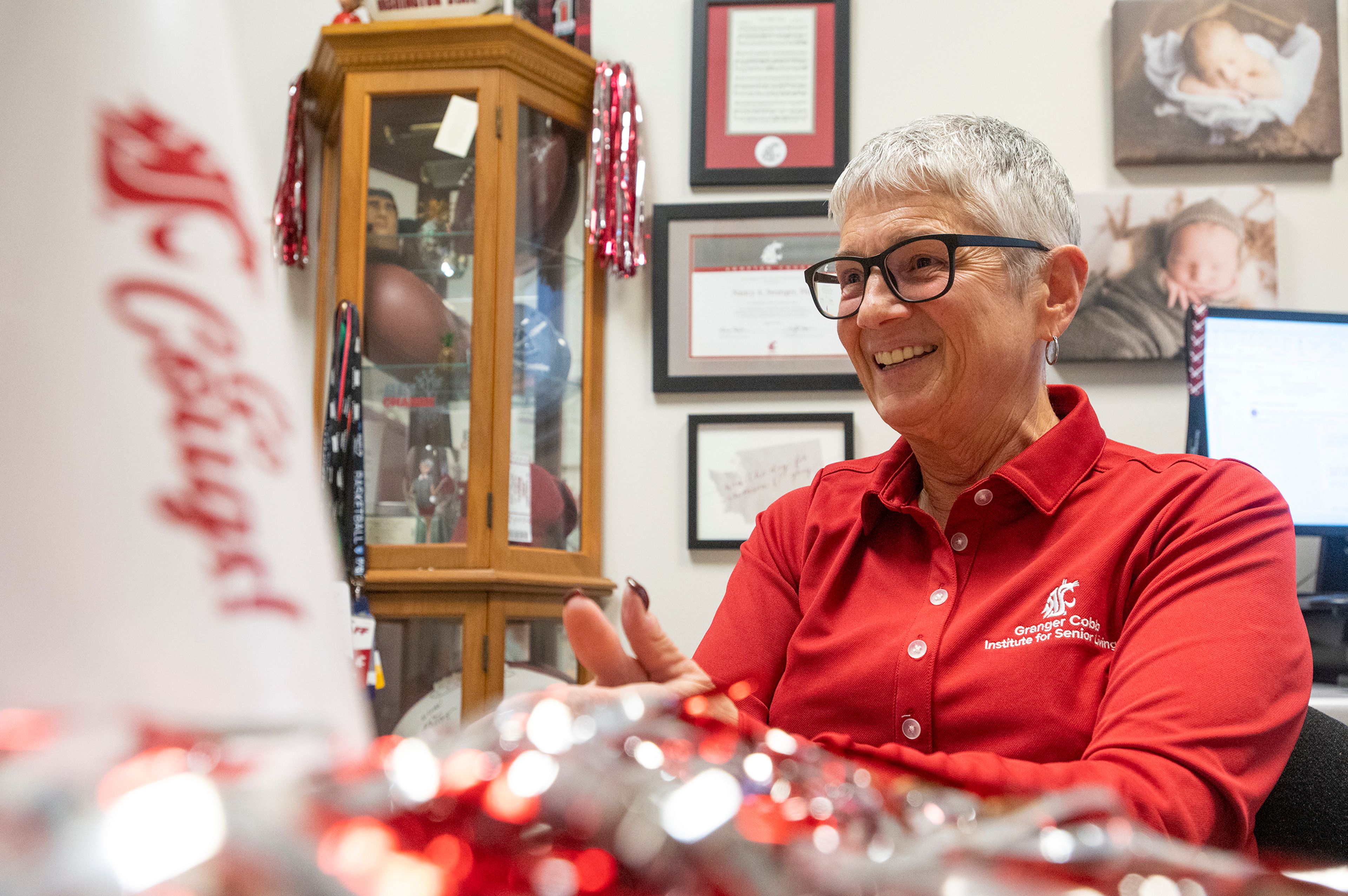 Dr. Nancy Swanger, the founding director of the Granger Cobb Institute for Senior Living at Washington State University, talks about first-hand knowledge in hospitality, including over 40 years of restaurant experience, in her Pullman office on Tuesday.