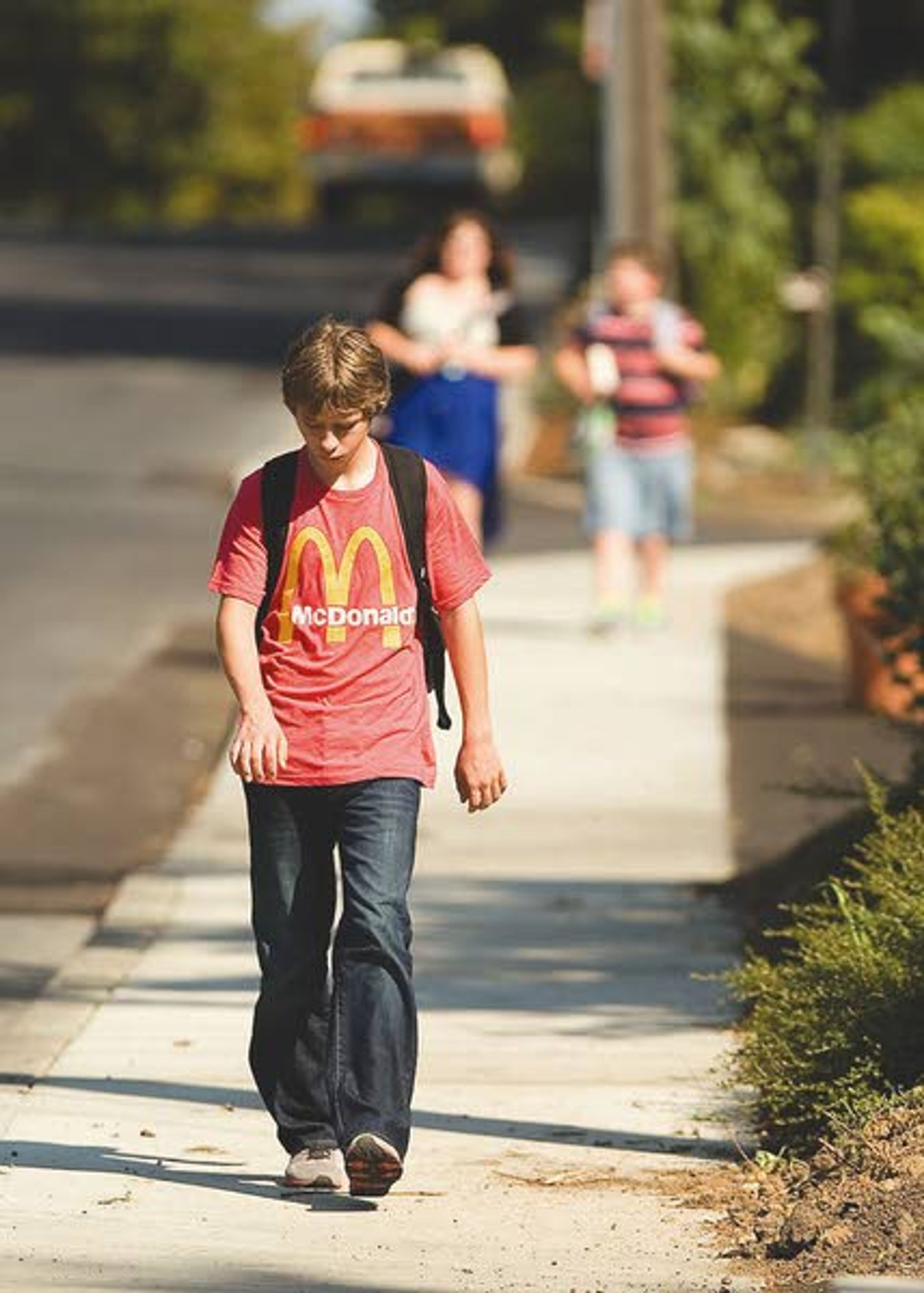 Children walk on a new sidewalk on East D Street in Moscow after school on Wednesday.