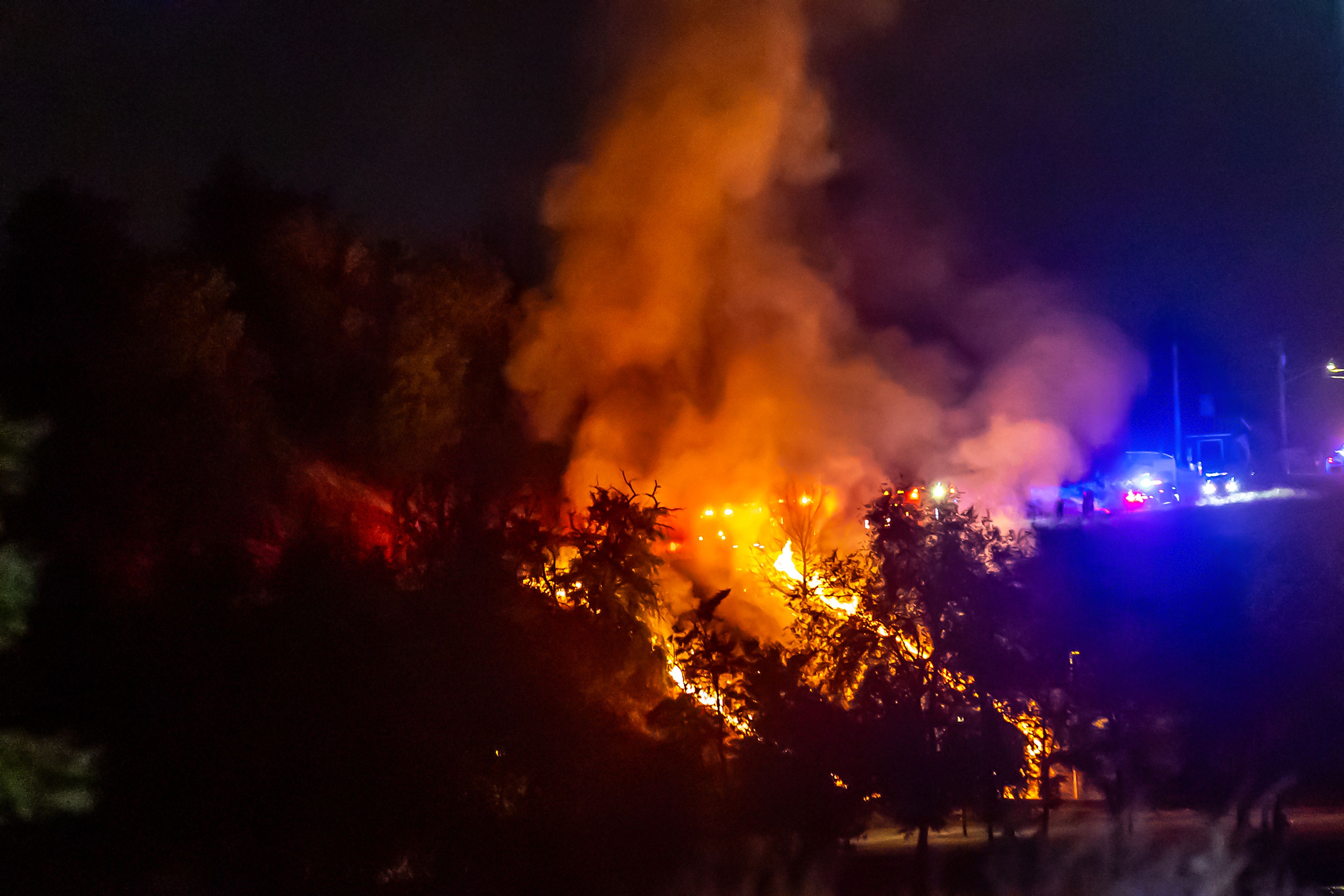 A fire burns at Beachview park Thursday in Clarkston after the conclusion of the fireworks show.