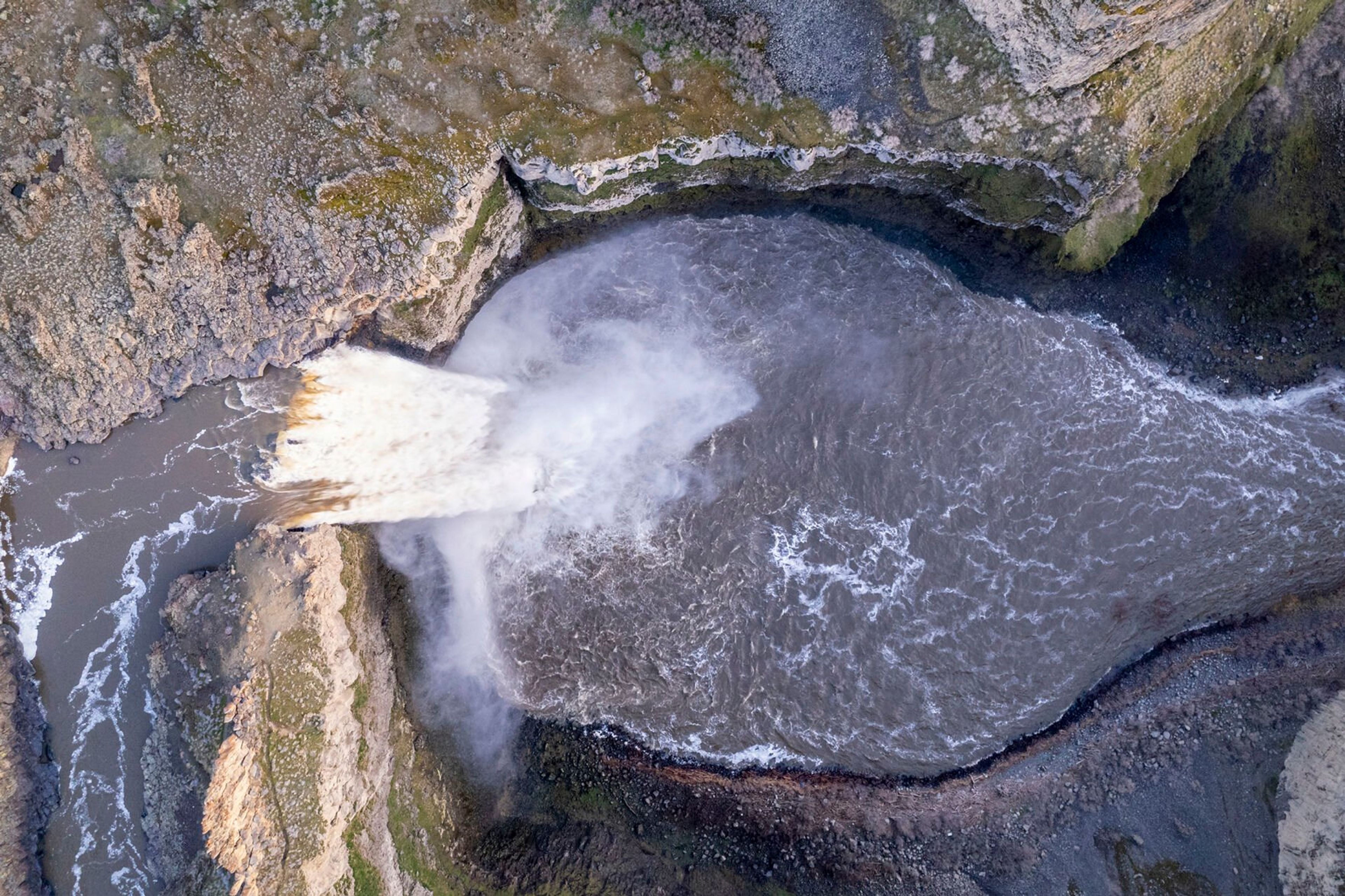 A photo taken with a drone shows a top-down view of Palouse Falls in early March.