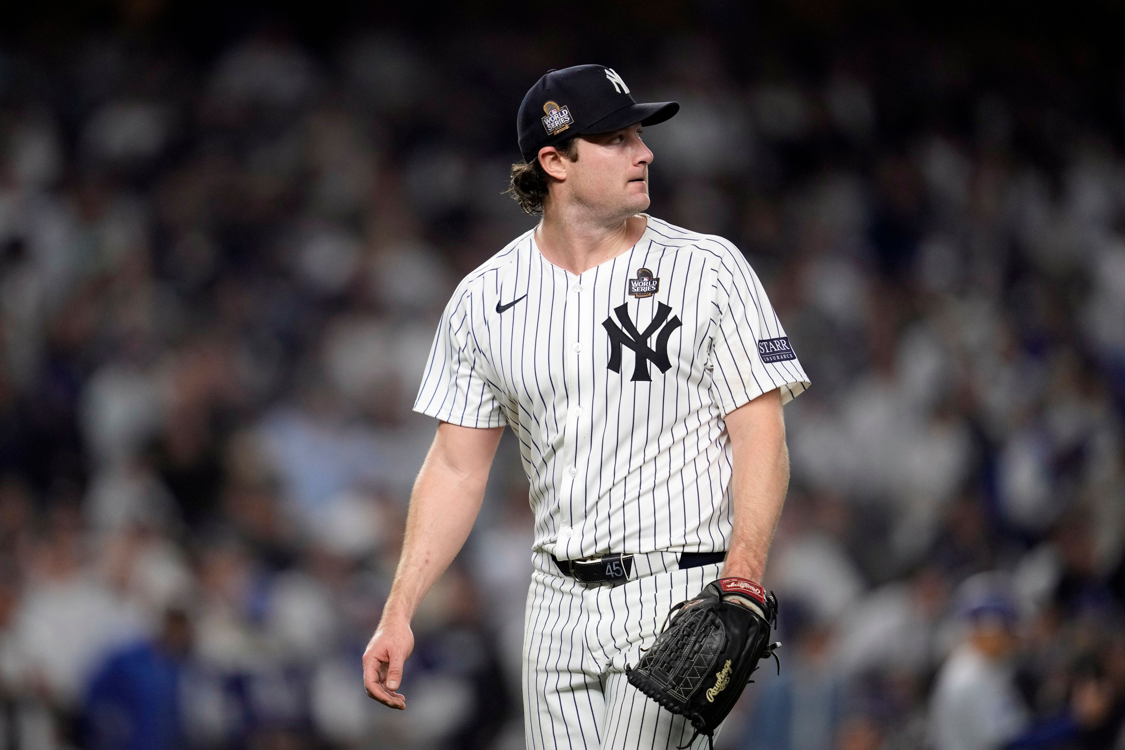 New York Yankees starting pitcher Gerrit Cole looks back toward the scoreboard after throwing against the Los Angeles Dodgers during the fifth inning in Game 5 of the baseball World Series, Wednesday, Oct. 30, 2024, in New York. (AP Photo/Godofredo A. VÃ¡squez)