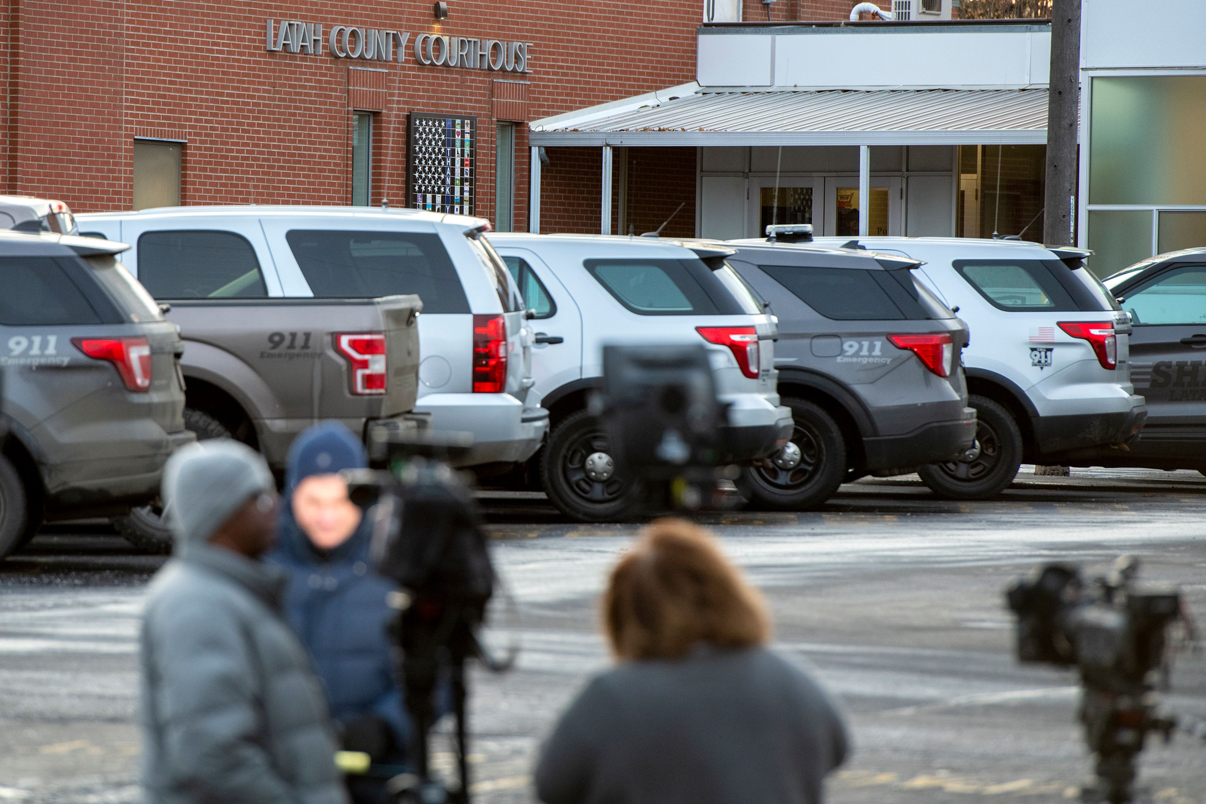 Media members setup cameras outside of the Latah County Jail as they wait for the arrival of Bryan Kohberger in Moscow on Wednesday. Kohberger is a suspect in a quadruple homicide case involving four University of Idaho students from Nov. 13.