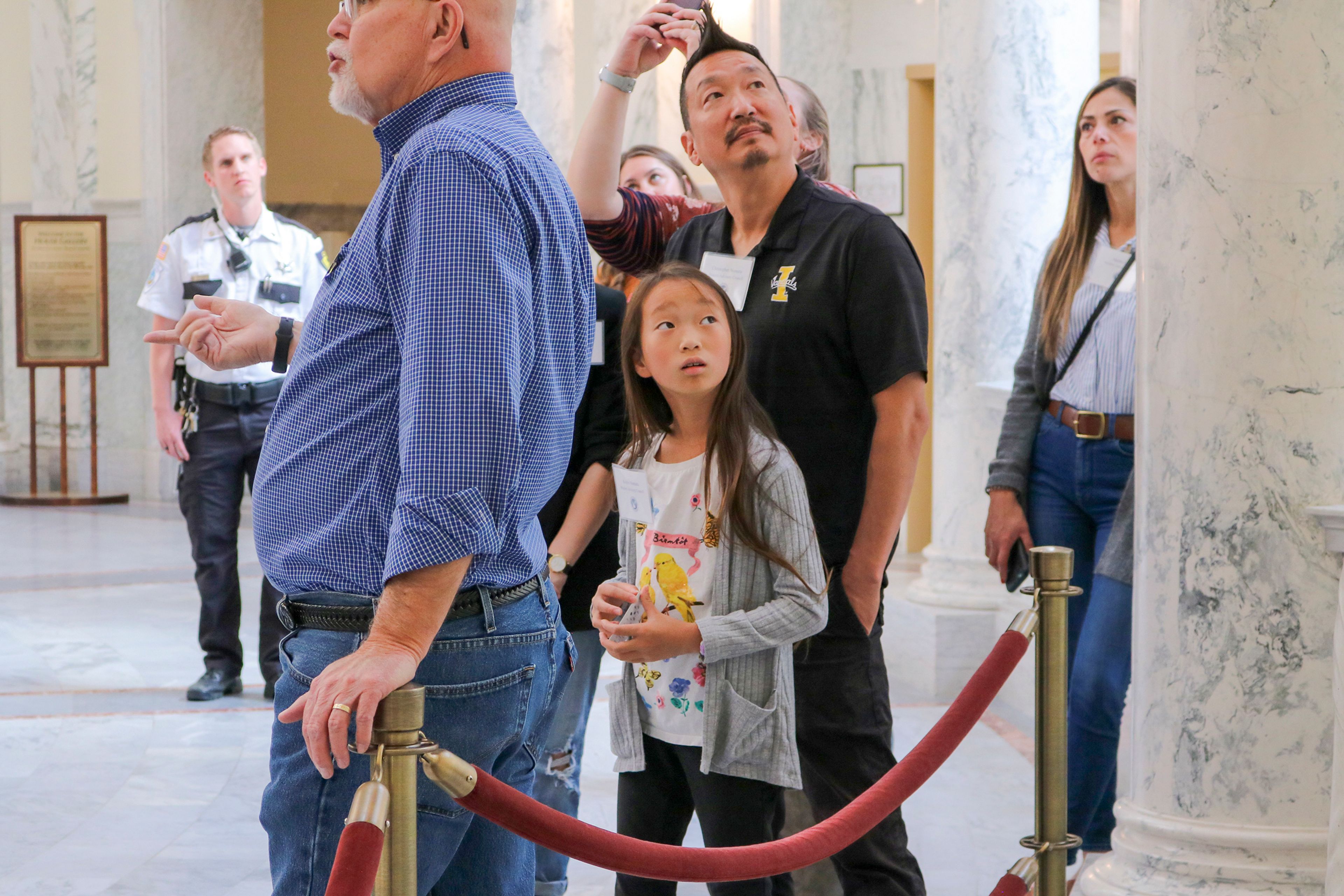 Koharu Nomura, middle, and her father, Chris, tour the Idaho Capitol as part of a trip to Boise for members of the Idaho Student Advisory Council.