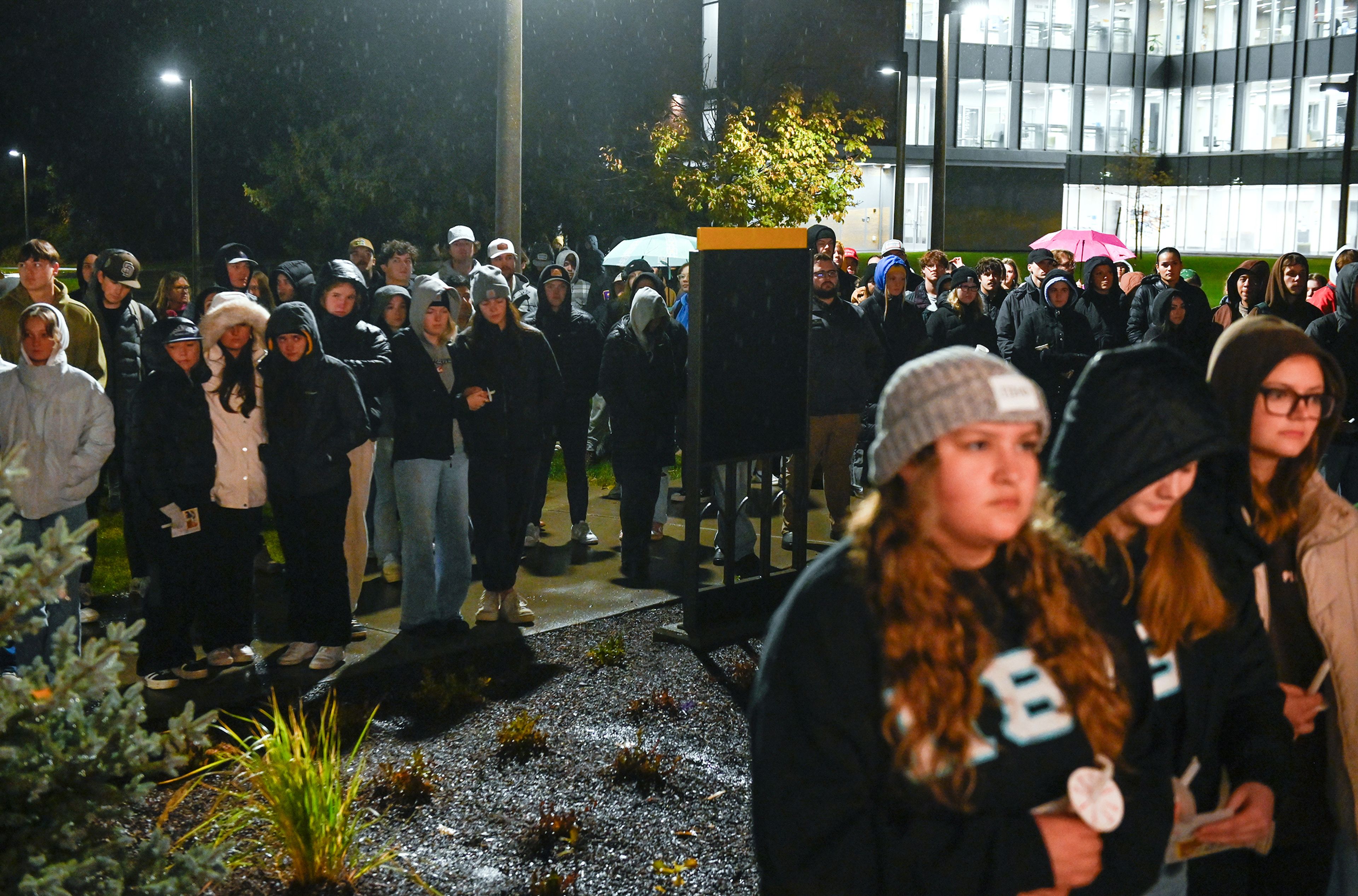 Those gathered for a vigil marking two years since the murder of four University of Idaho students stretch out into the lawn of the space Wednesday in Moscow.