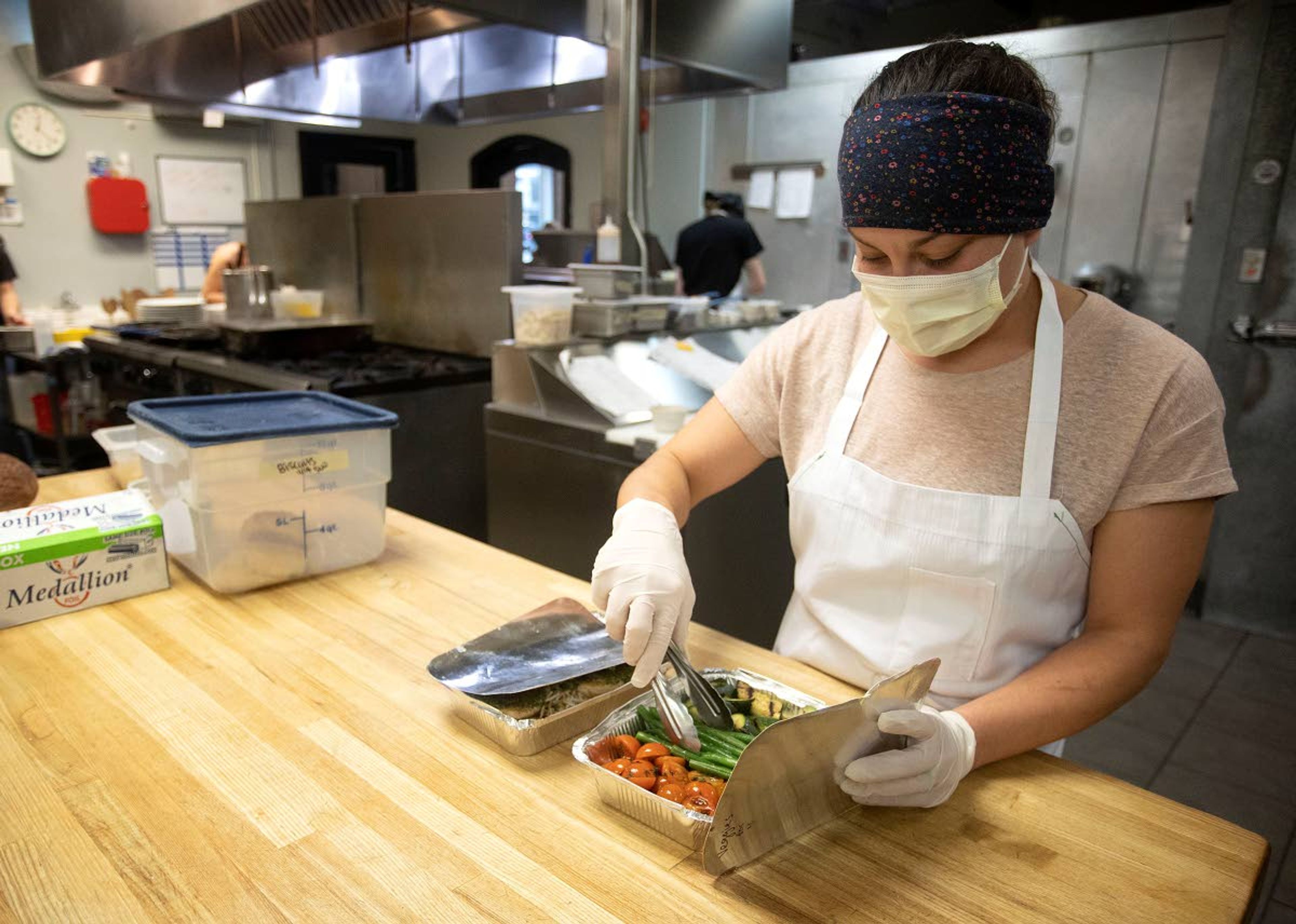 Kitchen Manager Stephanie Wilkes talks about a Feed a Family meal Monday at Bloom Cafe in Moscow. A customer can choose to split the cost of a meal with Bloom to be donated to a family in the Moscow School District.