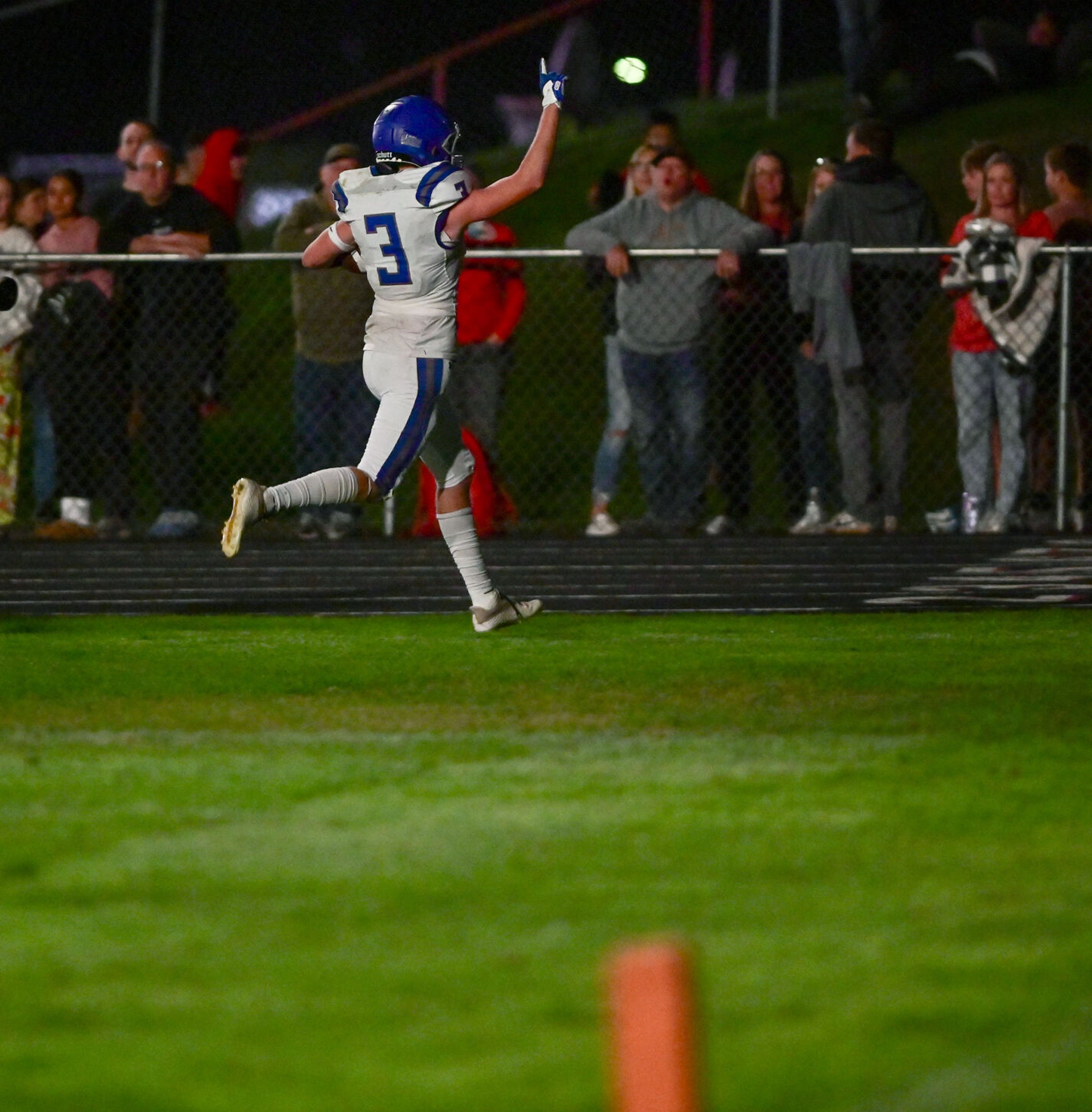 Pullman wide receiver Evan Anderson raises an arm as he runs into the end zone for the Greyhound’s second touchdown against Moscow Friday.