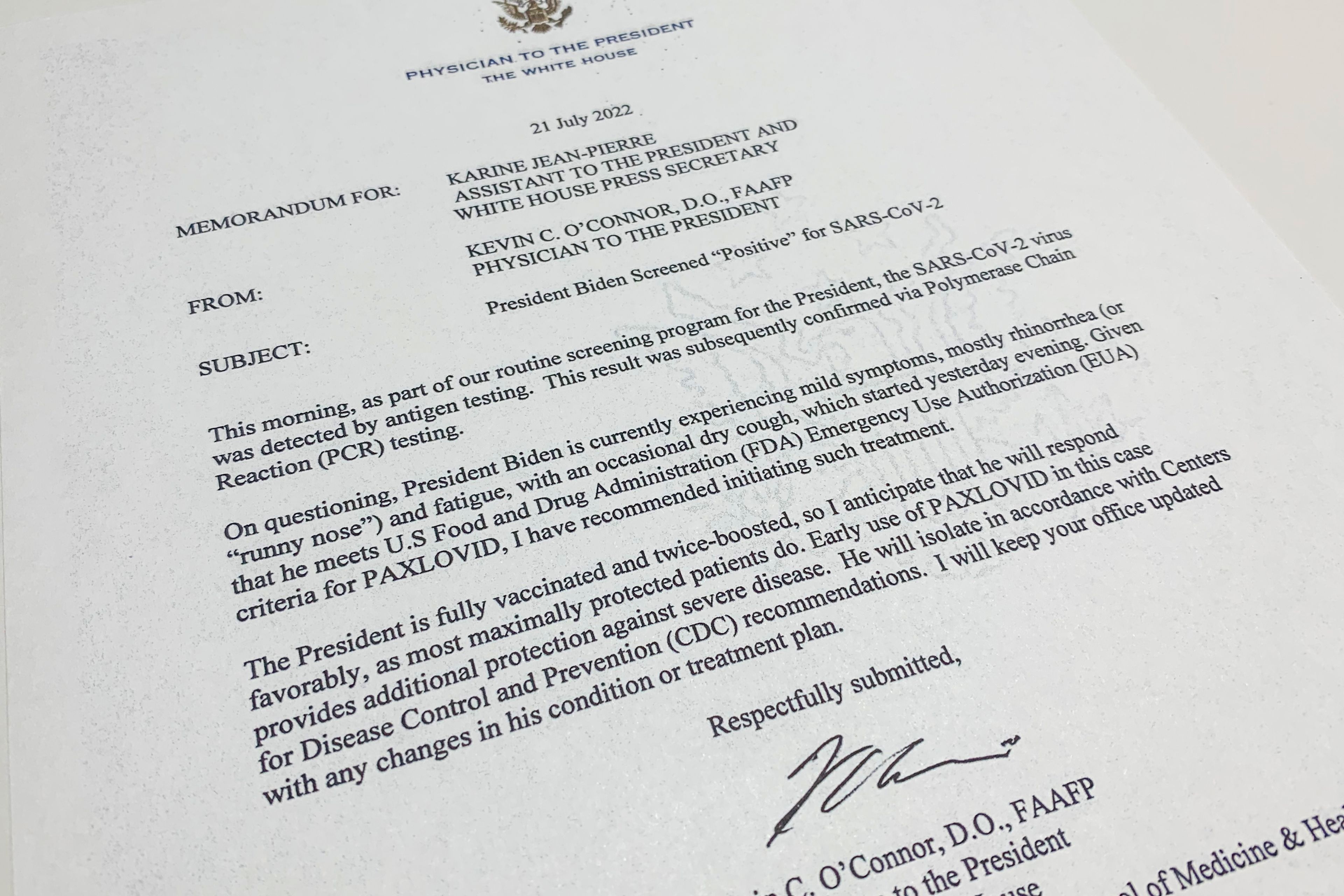 The memo from the Physician to the President Dr. Kevin O'Connor to White House press secretary Karine Jean-Pierre, photographed Thursday, July 21, 2022, announcing that President Joe Biden has tested positive for COVID-19. Biden says he's "doing great" after testing positive for COVID-19. The White House said Biden is experiencing "very mild symptoms," including a stuffy nose, fatigue and cough. He's taking Paxlovid, an antiviral drug designed to reduce the severity of the disease. (AP Photo/Jon Elswick)