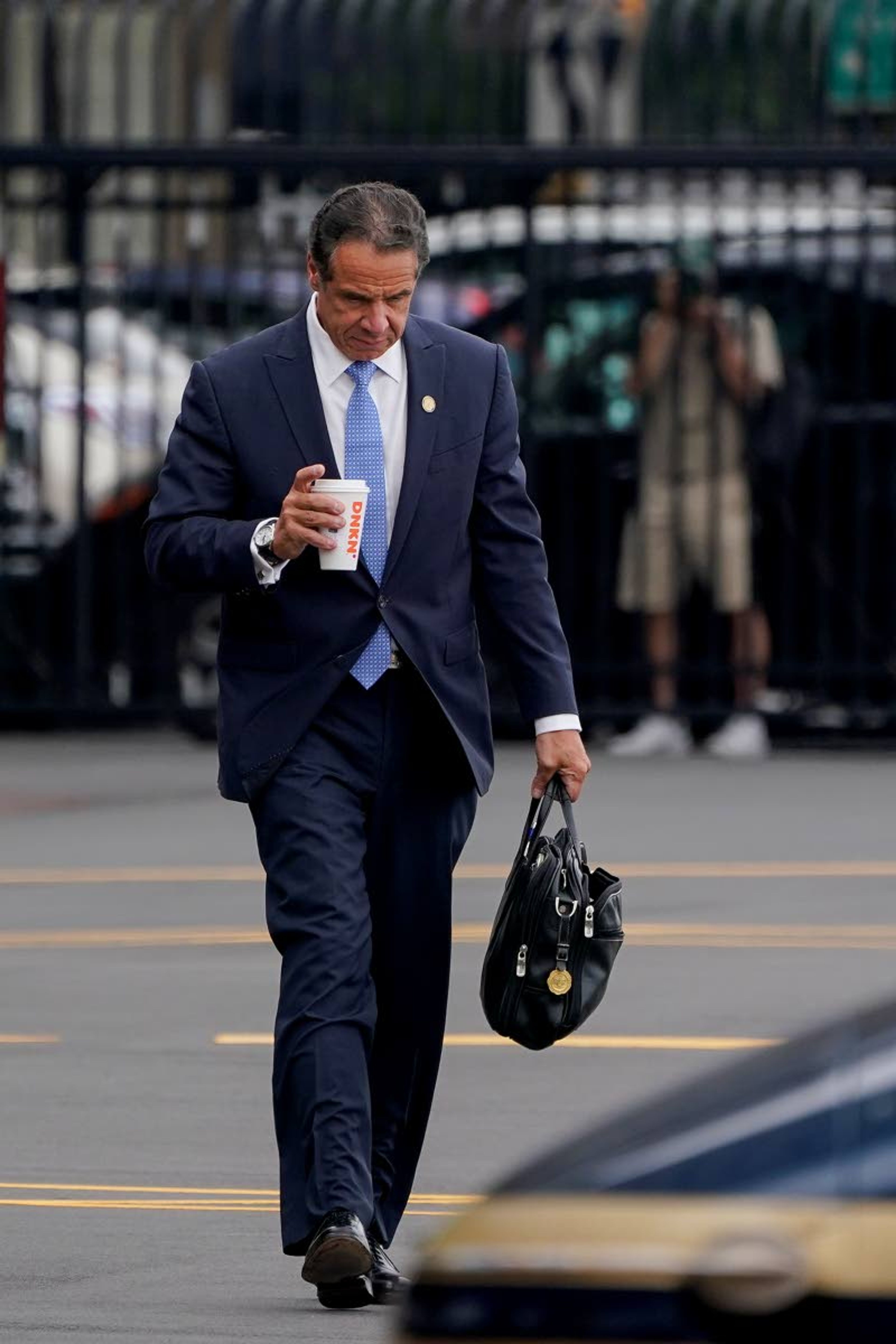 New York Gov. Andrew Cuomo prepares to board a helicopter after announcing his resignation, Tuesday, Aug. 10, 2021, in New York. Cuomo says he will resign over a barrage of sexual harassment allegations. The three-term Democratic governor's decision, which will take effect in two weeks, was announced Tuesday as momentum built in the Legislature to remove him by impeachment. (AP Photo/Seth Wenig)