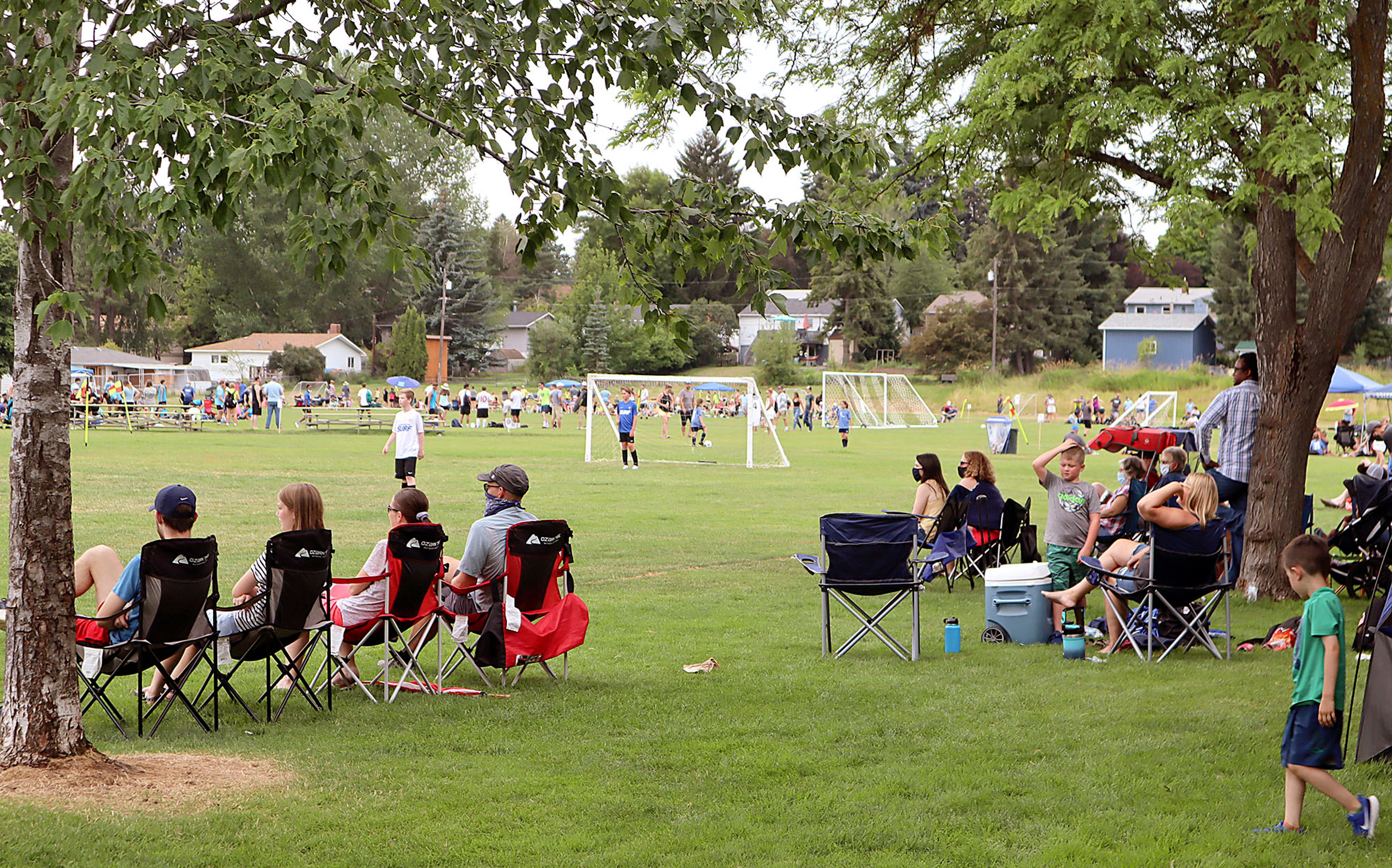 Fans watch a game at the Eastern Washington Surf Soccer Club Harvest Cup soccer tournament at Oylear Field in Moscow. The tournament was shut down on Sunday for violating the Moscow Mayor's order to wear masks in public places when social distancing isn't possible.