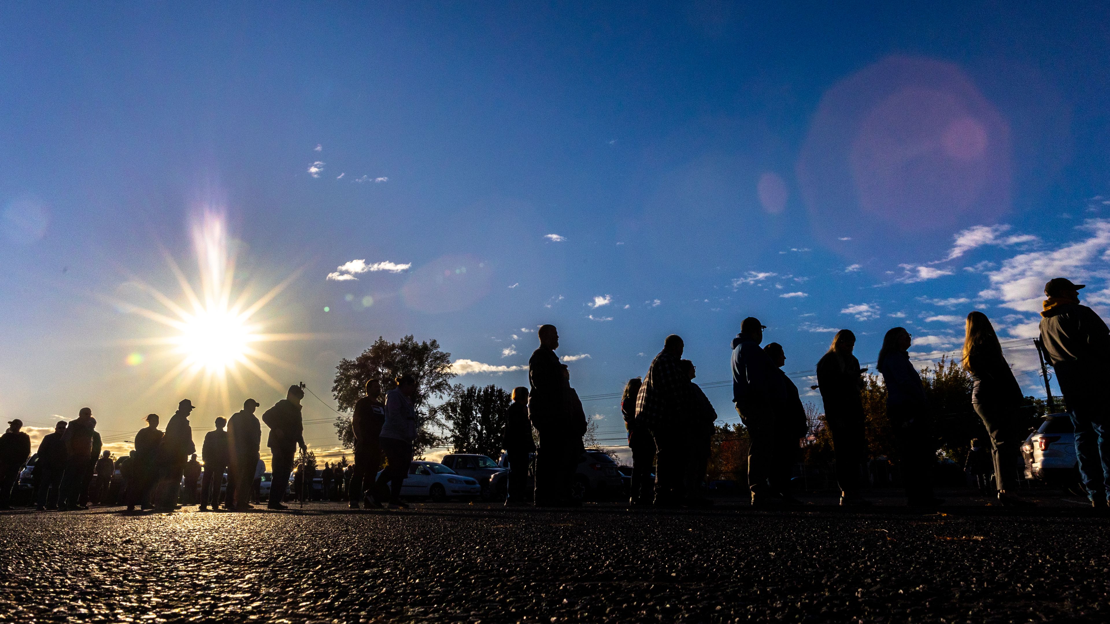 People wait in line for polls to open as the sun rises Tuesday at the Nez Perce County Fairgrounds in Lewiston.