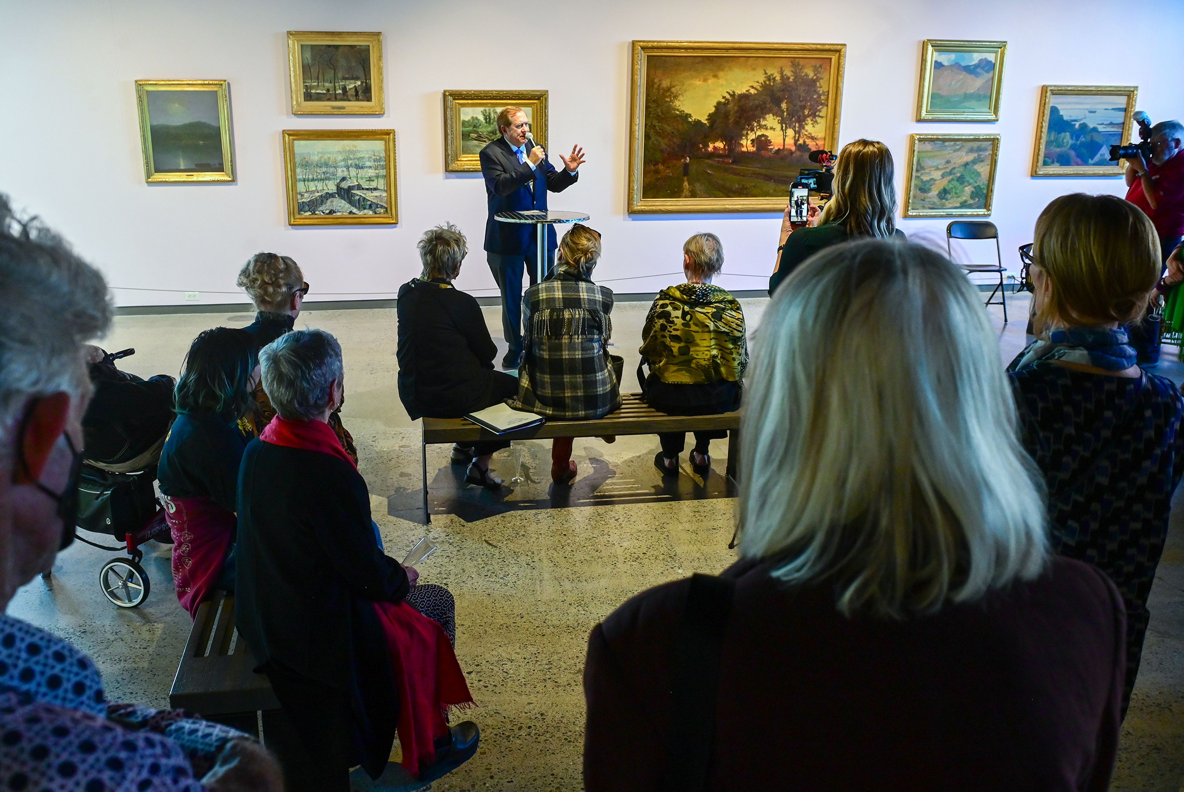 Jordan Schnitzer, center, founder of the Jordan Schnitzer Family Foundation, speaks during a reception and book release to celebrate the museums 50 year anniversary Thursday at the Jordan Schnitzer Museum of Art at Washington State University in Pullman.,