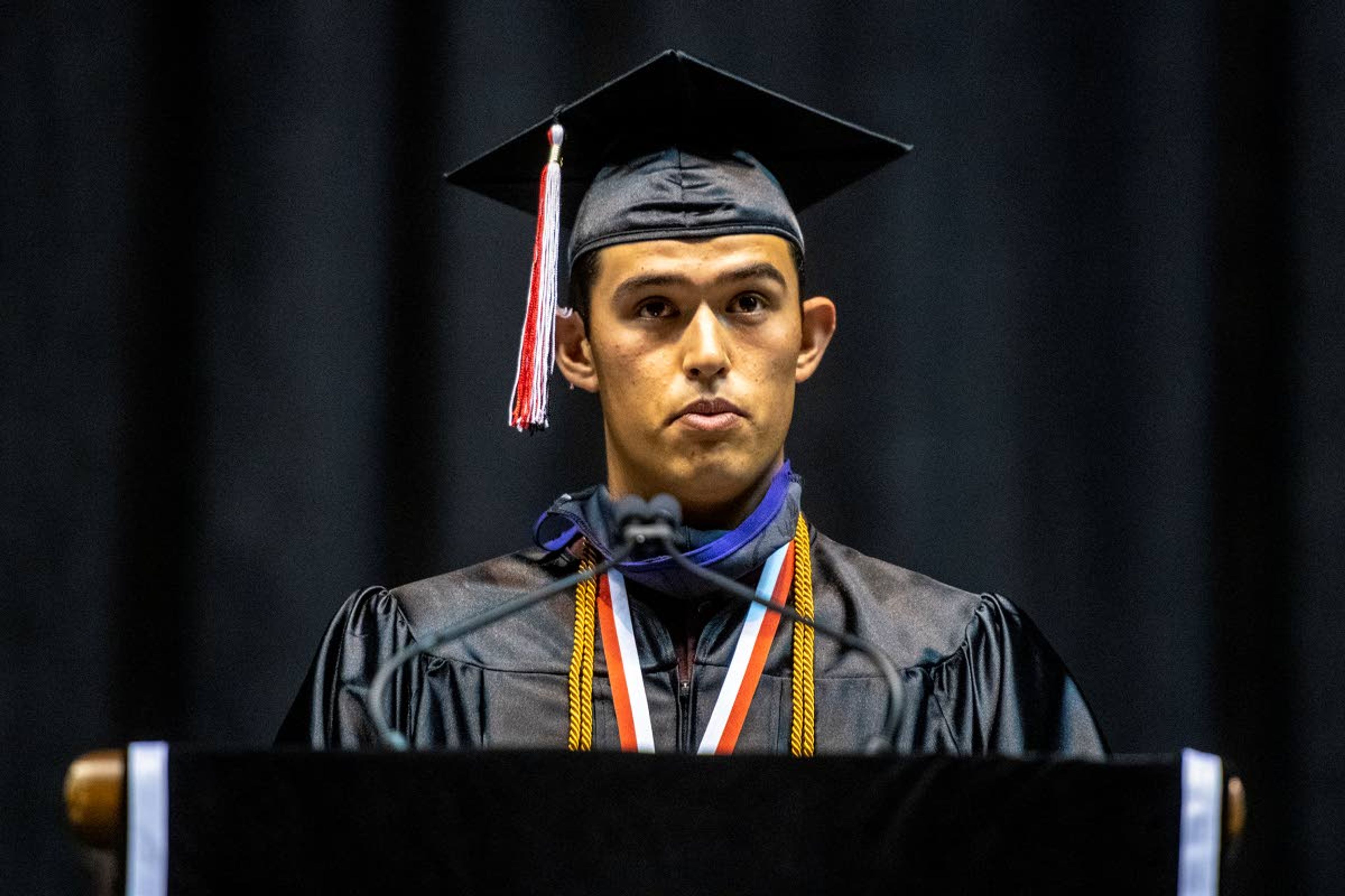 Moscow High School class President Isaac Staszkow speaks to his fellow classmates during their graduation commencement at the University of Idaho’s Kibbie Dome on Friday night.