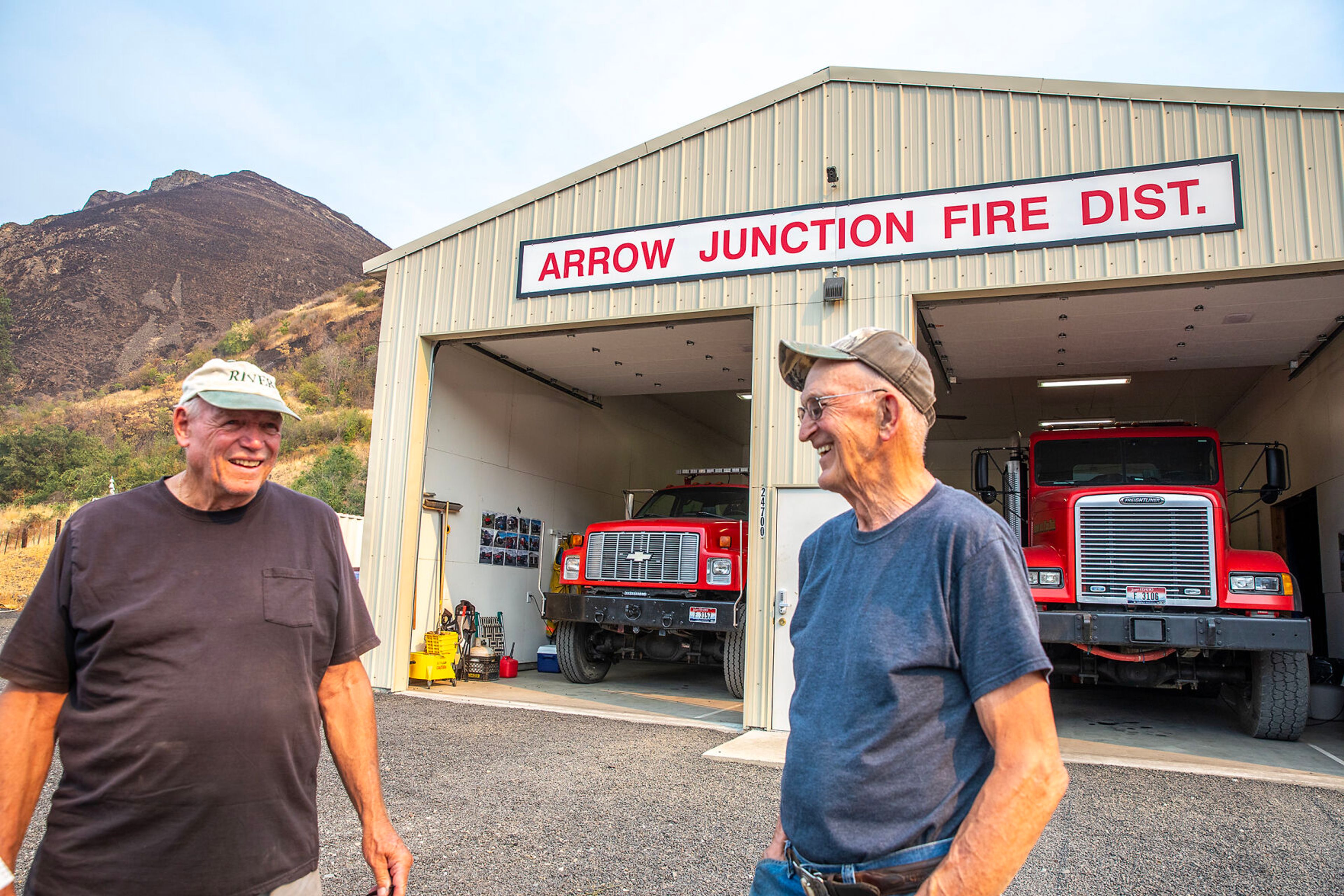 LuVerne Grussing, left, and Gene Wightman stand outside the Arrow Junction Fire Protection District.