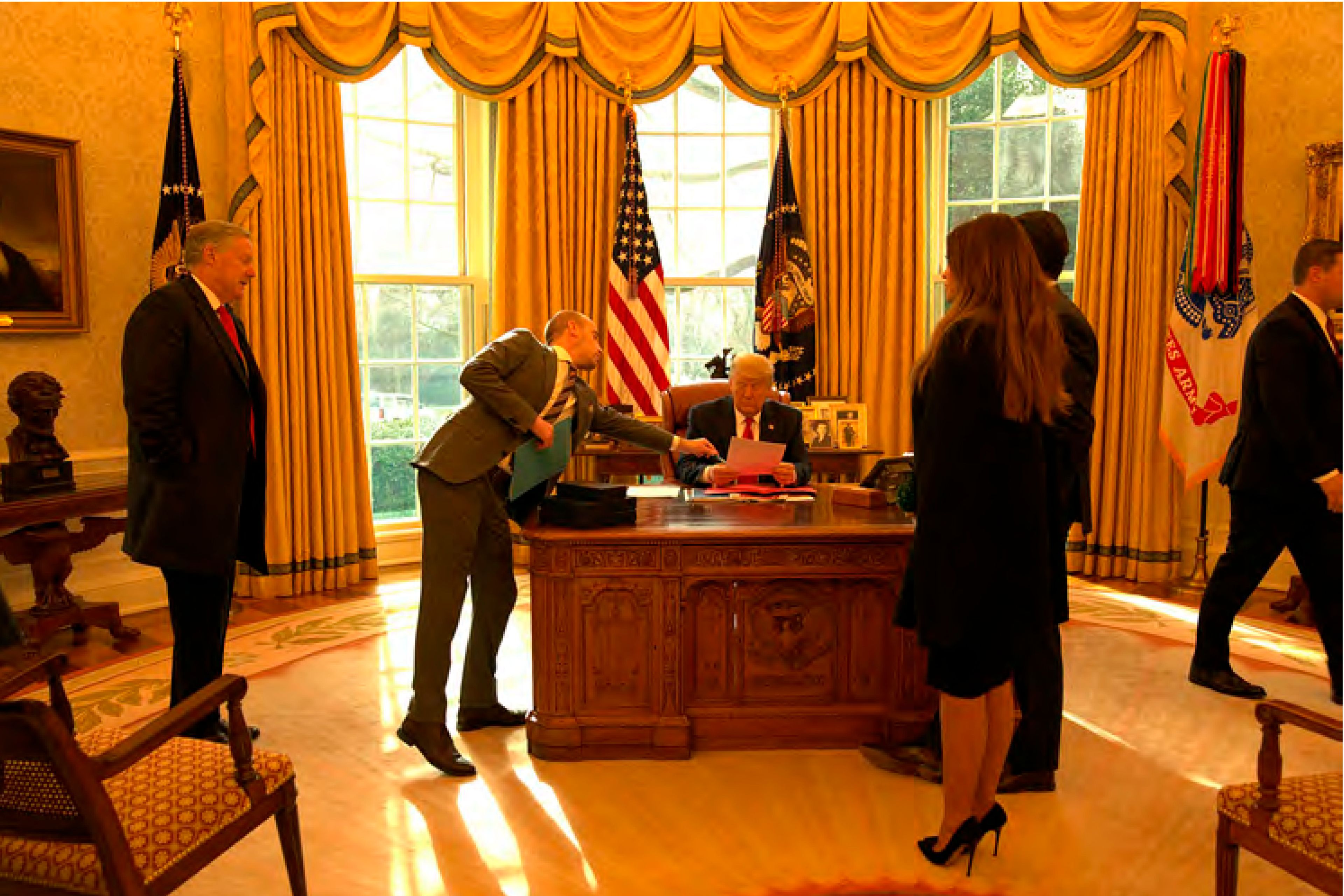 In this image released in the final report by the House select committee investigating the Jan. 6 attack on the U.S. Capitol, on Thursday, Dec. 22, 2022, President Donald Trump reviews his speech with Stephen Miller in the Oval Office of the White House on the morning of Jan. 6, 2021. (House Select Committee via AP)