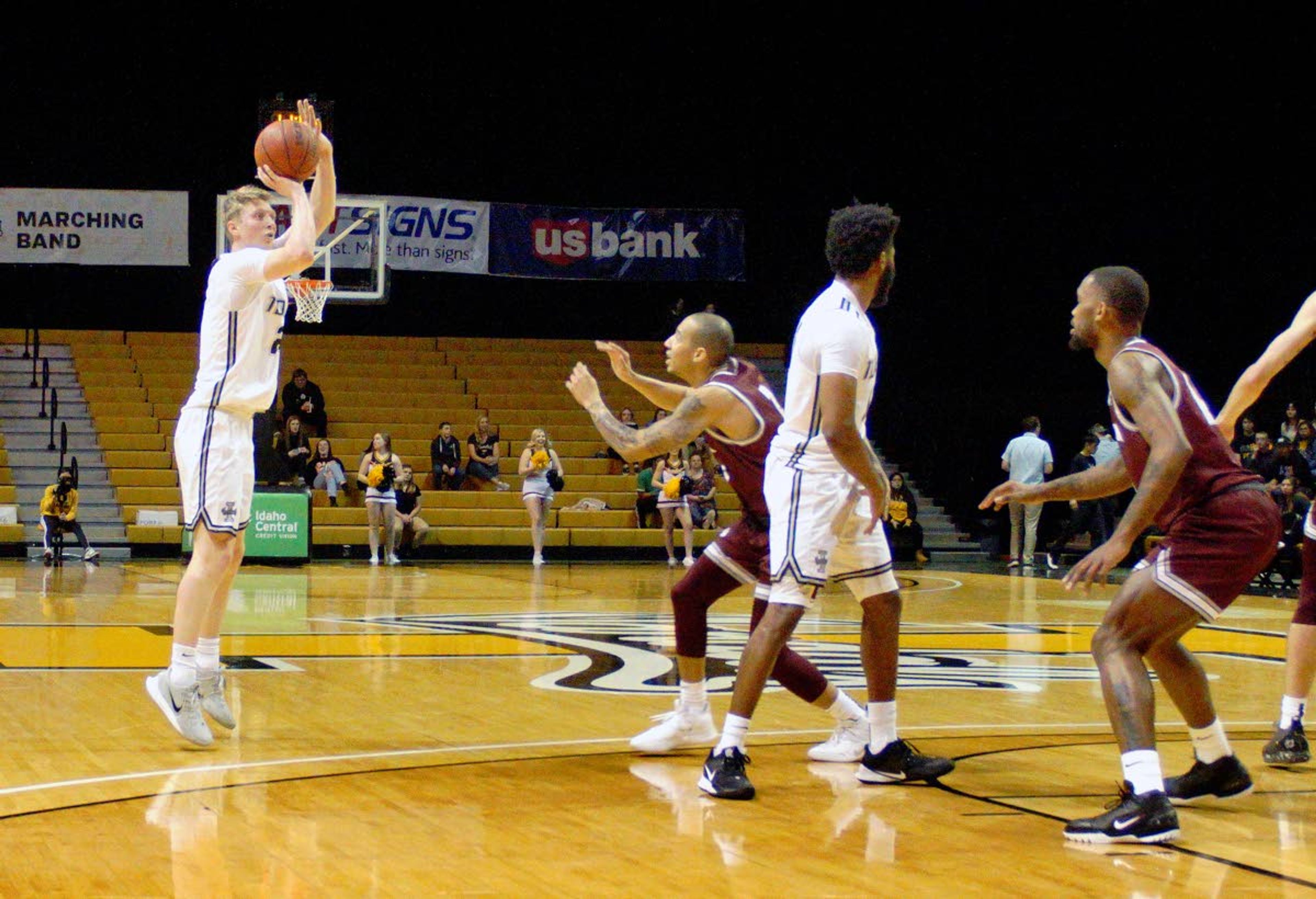 Idaho freshman Gabe Quinnett, left, launches a 3-point shot against Montana Saturday.