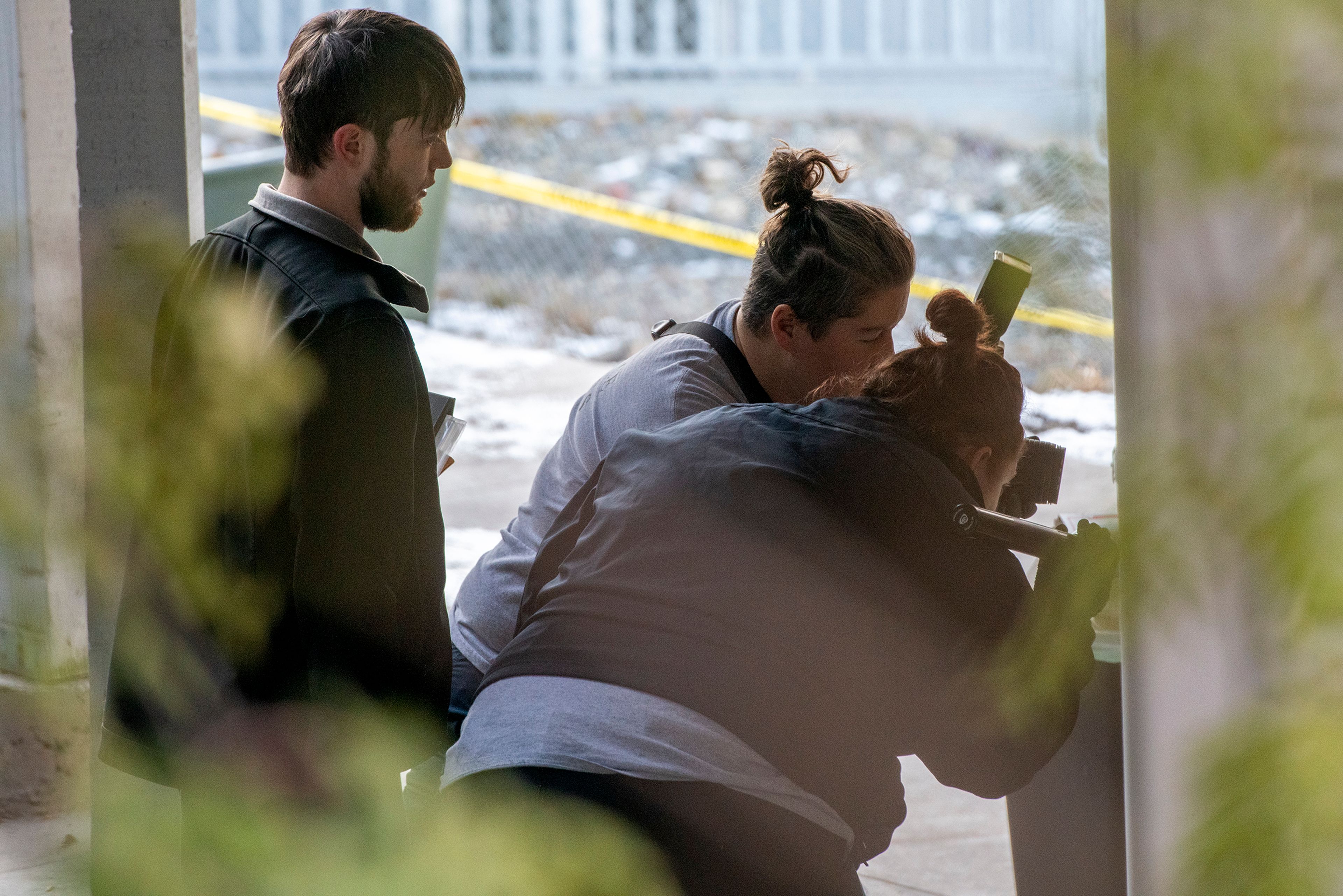 Members of the Idaho State Police forensic team investigate Friday at a home where four University of Idaho students were recently murdered over the weekend in Moscow.