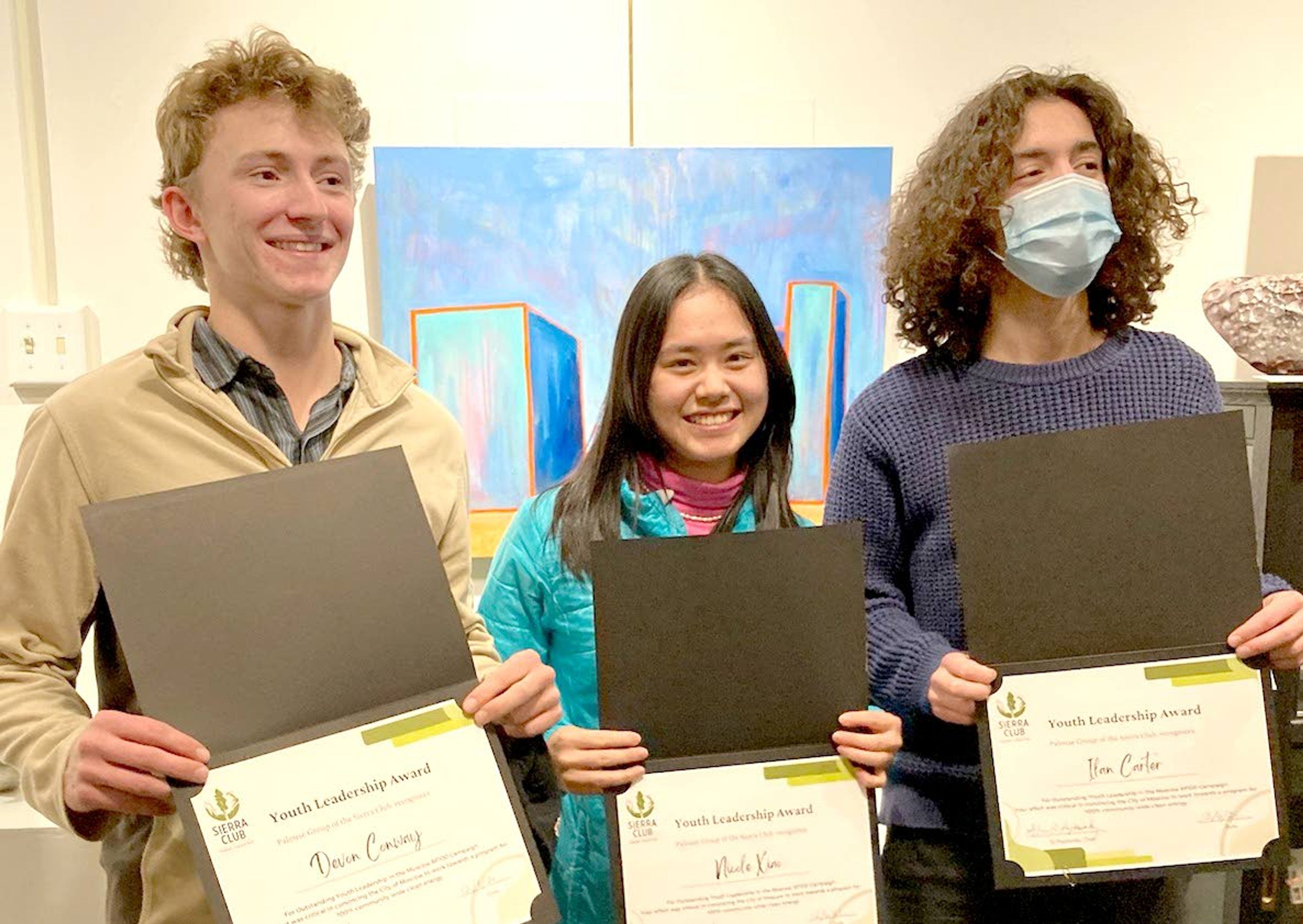 From left, Moscow High Students Devon Conway and Nicole Xiao, center, along with recent MHS graduate Ilan Carter display their awards from the Sierra Club at Monday’s City Council meeting.