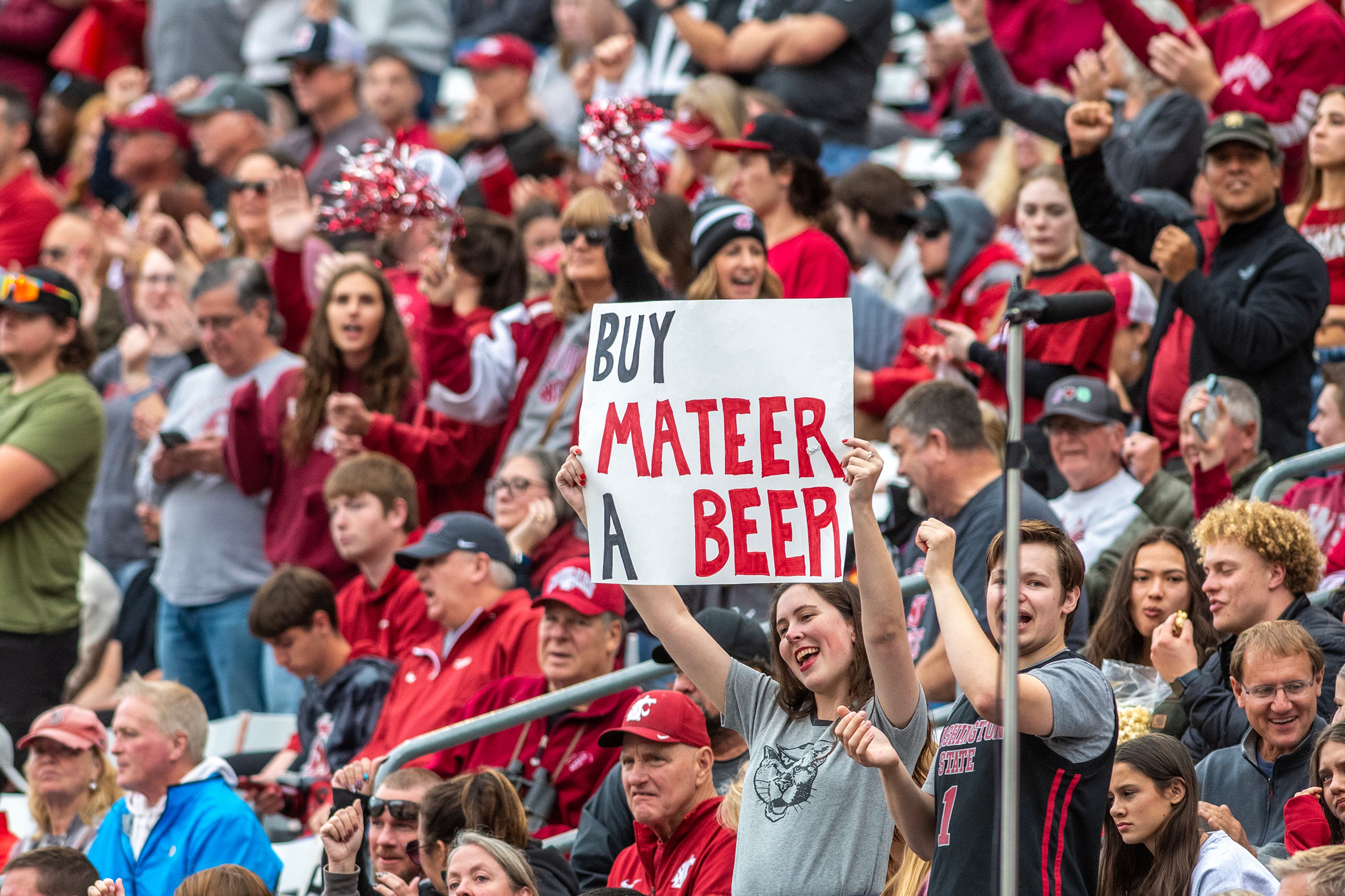 A fan holds up a sign as Washington State faces Hawaii in a college football game on Saturday at Gesa Field in Pullman. WSU defeated Hawaii 42-10.,