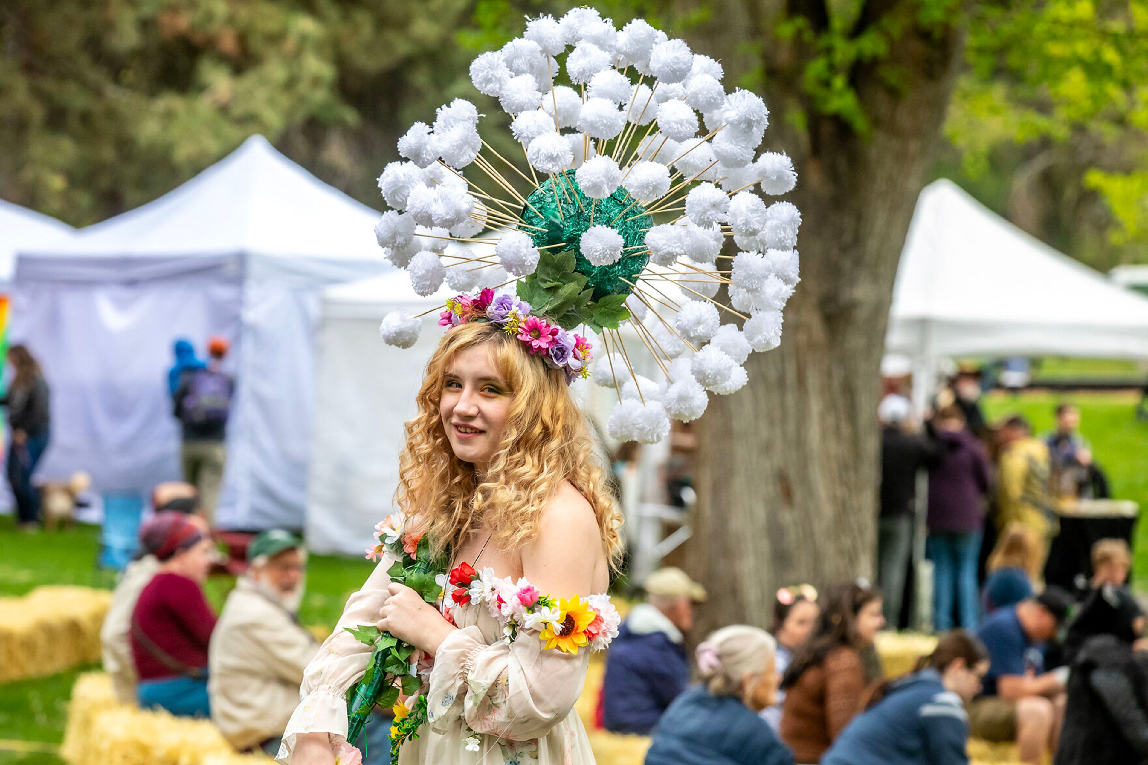 Bethani Anderson stands at the Moscow Renaissance Fair dressed in a flower themed costume Saturday at East City Park in Moscow.