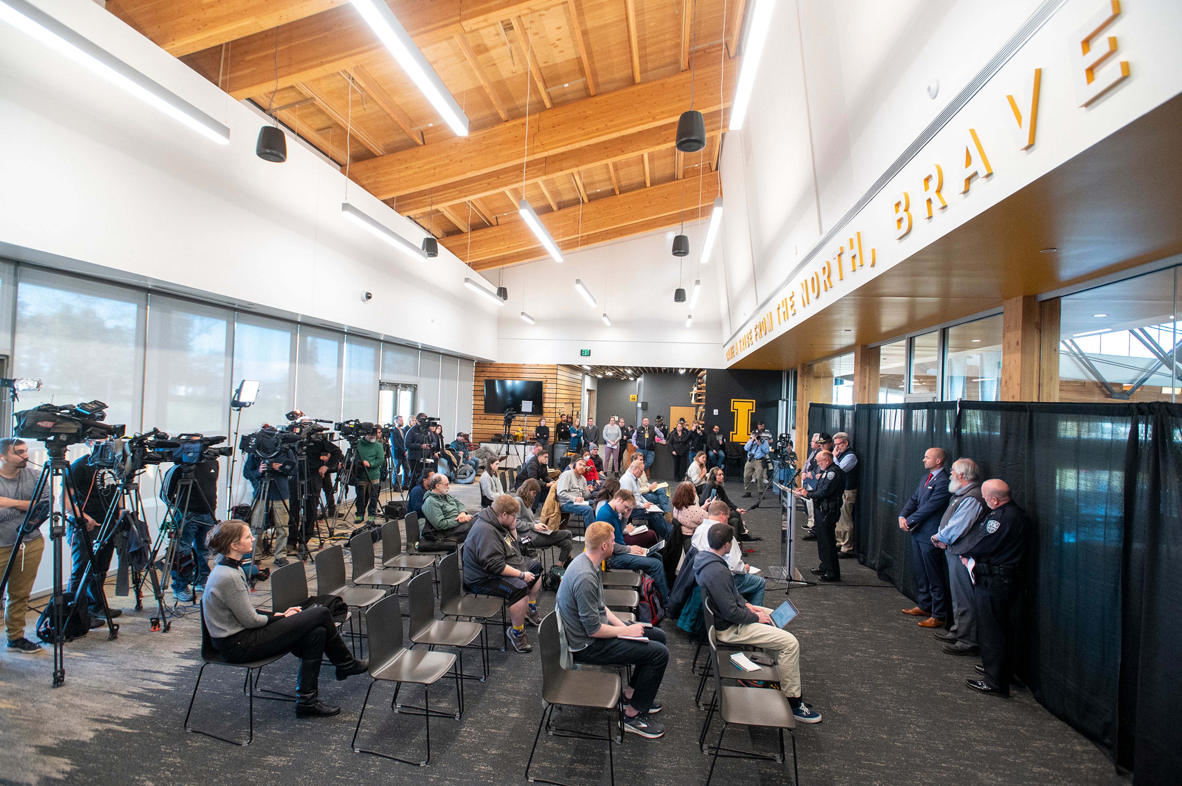 Media members gather as Moscow Police Captain Roger Lanier speaks at a press conference about a quadruple homicide investigation involving four University of Idaho students at the Idaho Central Credit Union Arena on Wednesday in Moscow.