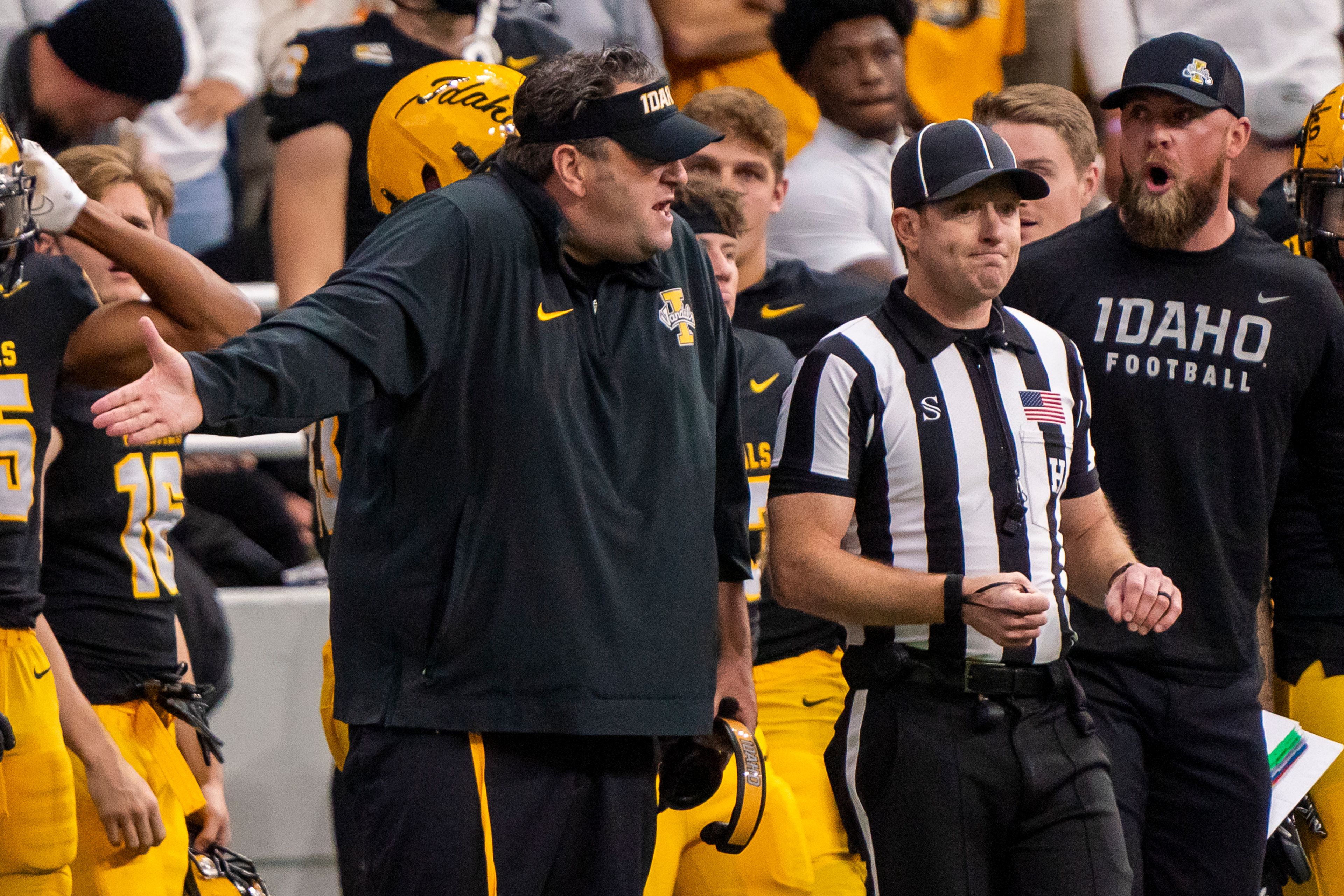 Idaho head coach Jason Eck, left, yells at a referee after an offensive pass interference call was made against the Vandals during their game against Montana State on Oct. 28, 2023, at the Kibbie Dome in Moscow.