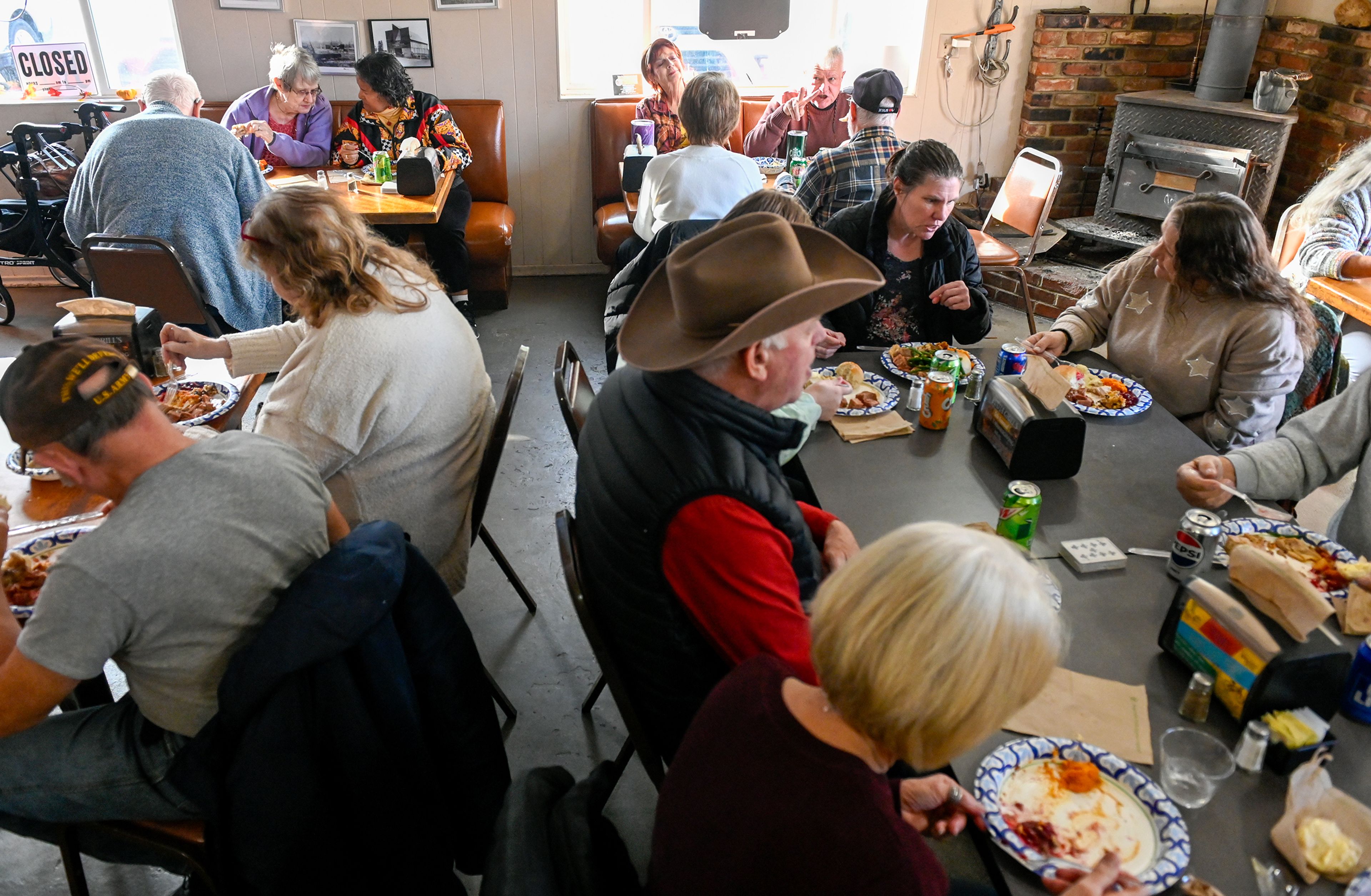 People fill the tables at Waha Grill Thursday during the restaurant’s annual free Thanksgiving meal on the outskirts of Lewiston.