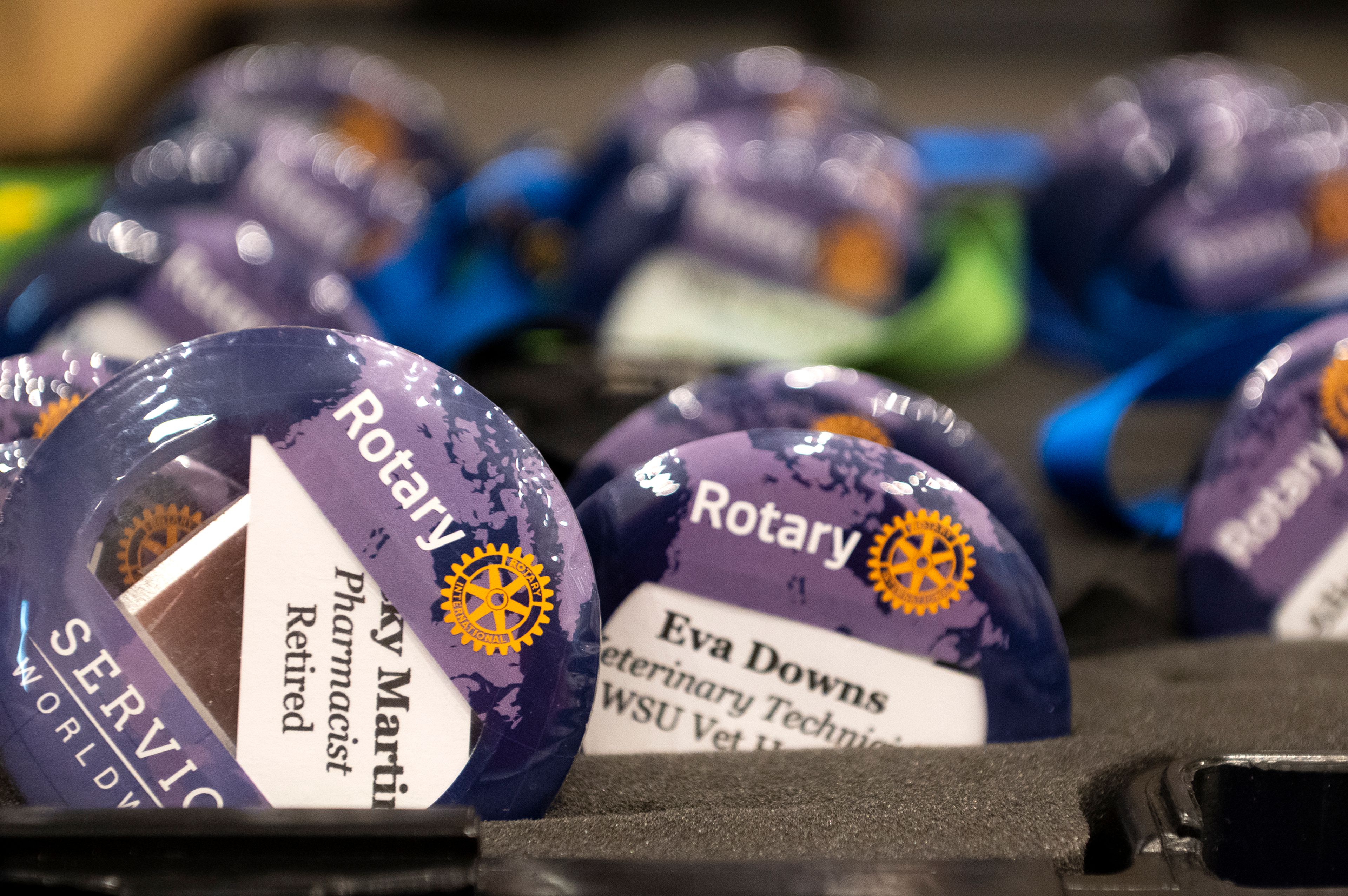 Rotary Club of Pullman name buttons are displayed for members at their weekly meeting.