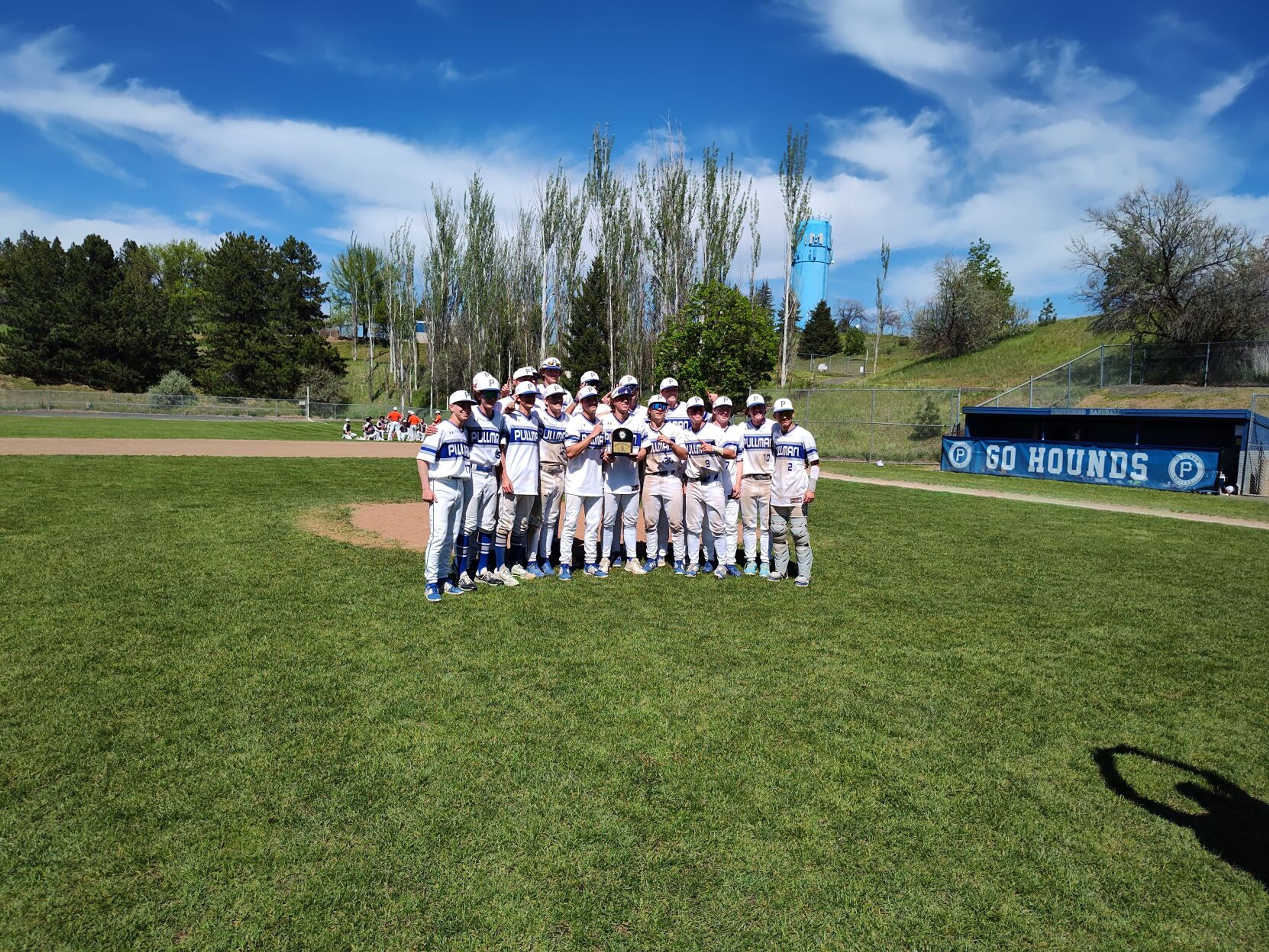 The Pullman baseball team poses with its Washington 2A district championship trophy after defeating West Valley 8-4 on Saturday, May 11, 2024, at Pullman High School.