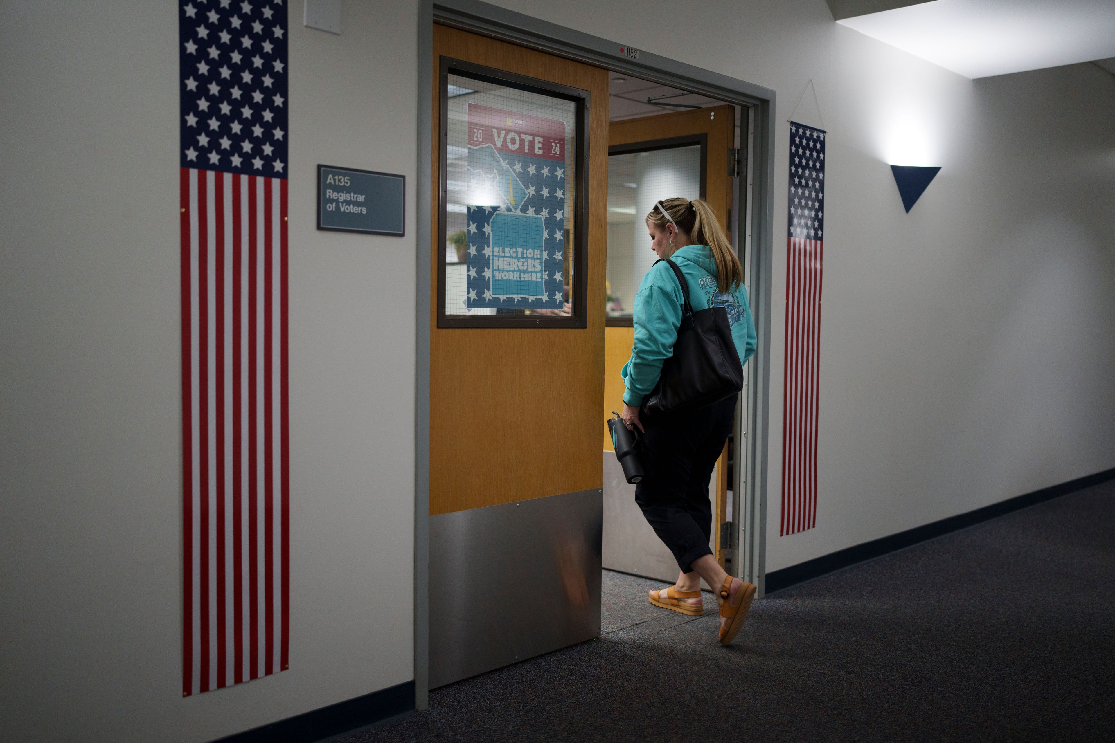 Cari-Ann Burgess, interim Registrar of Voters for Washoe County, Nev., arrives at the office Saturday, Sept. 21, 2024, in Reno, Nev. (AP Photo/John Locher)