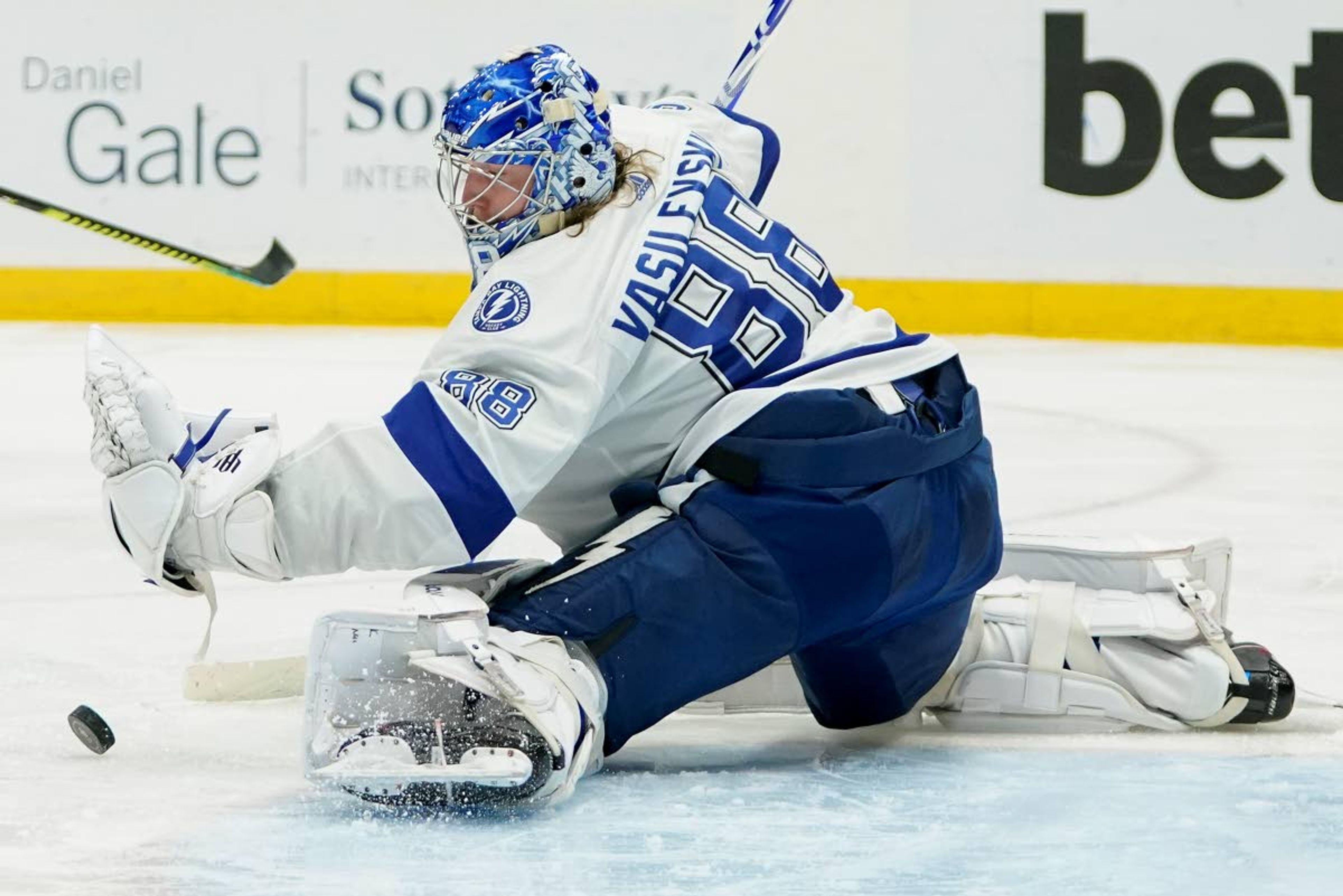 Tampa Bay Lightning goaltender Andrei Vasilevskiy (88) deflects a shot from the New York Islanders during the second period of Game 6 of the NHL hockey Stanley Cup semifinals, Wednesday, June 23, 2021, in Uniondale, N.Y. (AP Photo/Frank Franklin II)