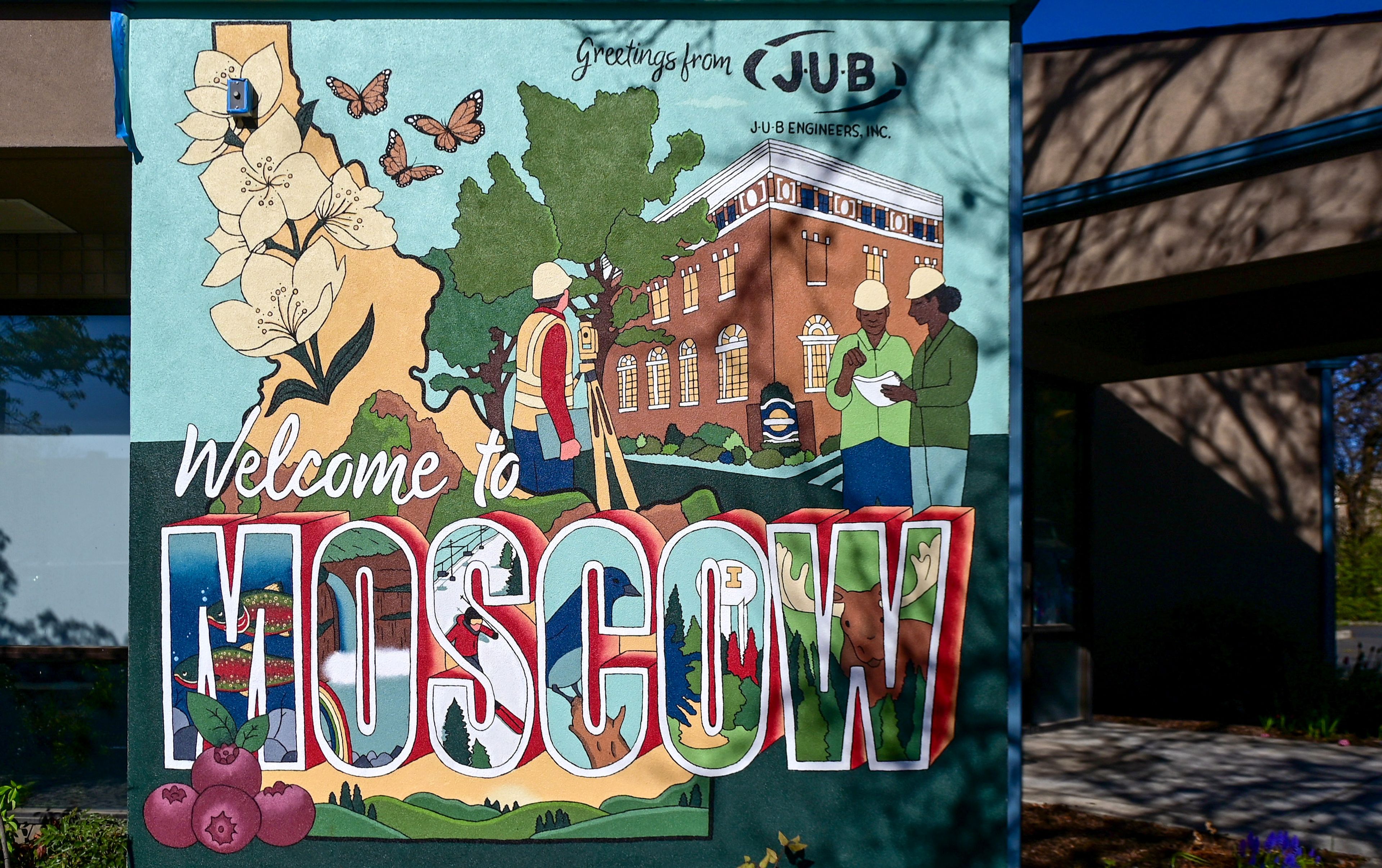 A Moscow-themed mural by University of Idaho graduate student Madelynn Gregoire is visible on the side of the J-U-B Engineers building in downtown Moscow on Monday. Sights from Moscow, including city hall and a moose, are combined with state imagery in the mural.