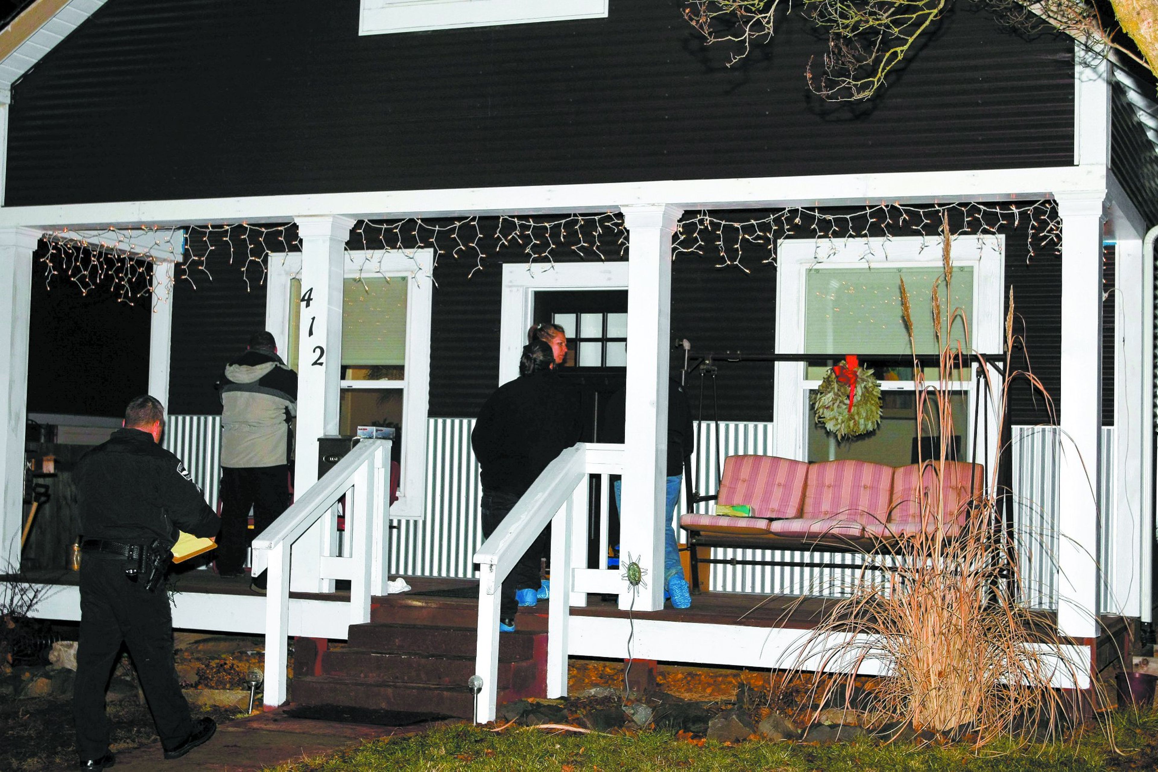 Investigators search the home of shooting victim Terri Grzebielski at 412 Veatch St. in Moscow.