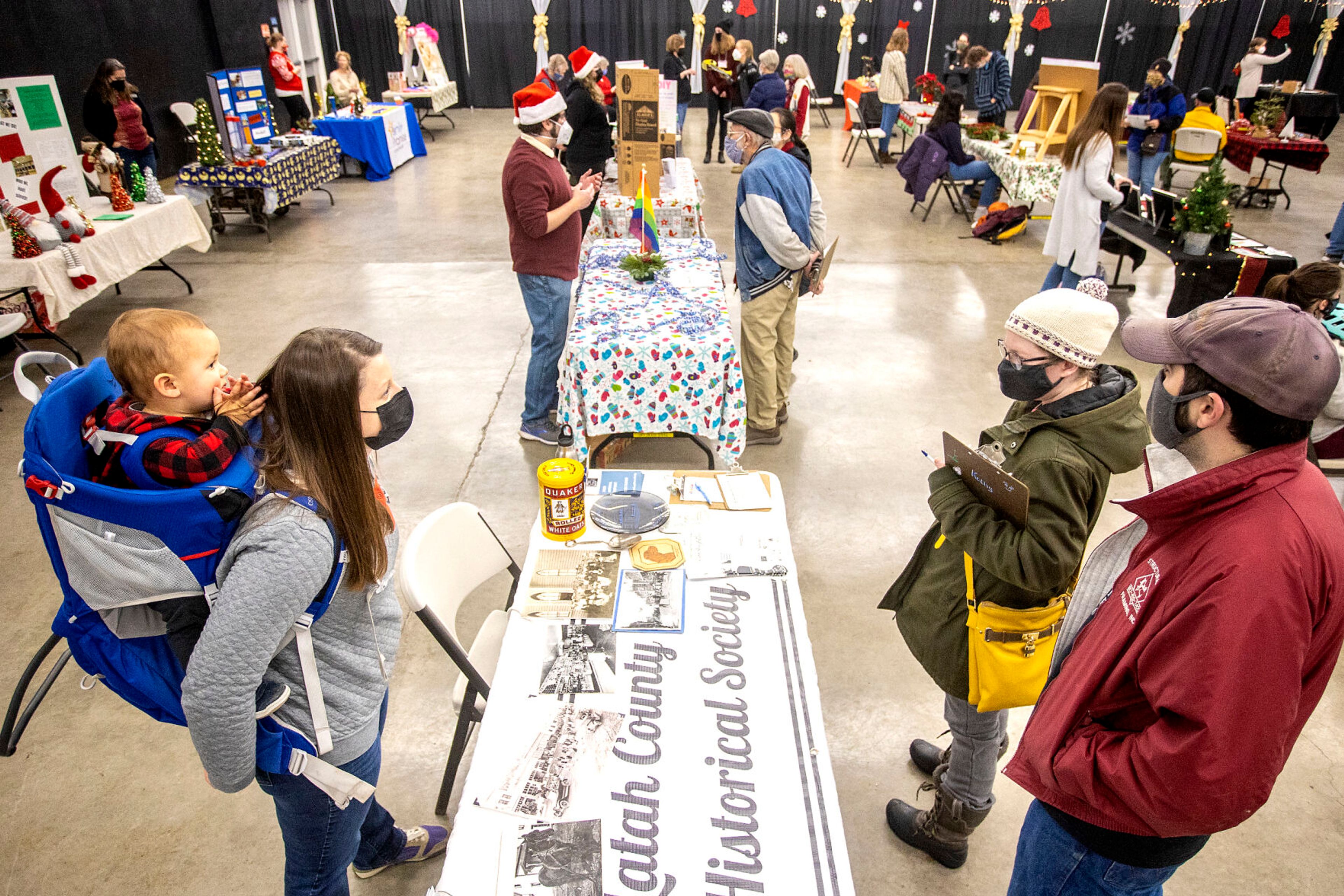 People talk with various non-profit organizations at the Alternative Giving Market in Moscow on Saturday.