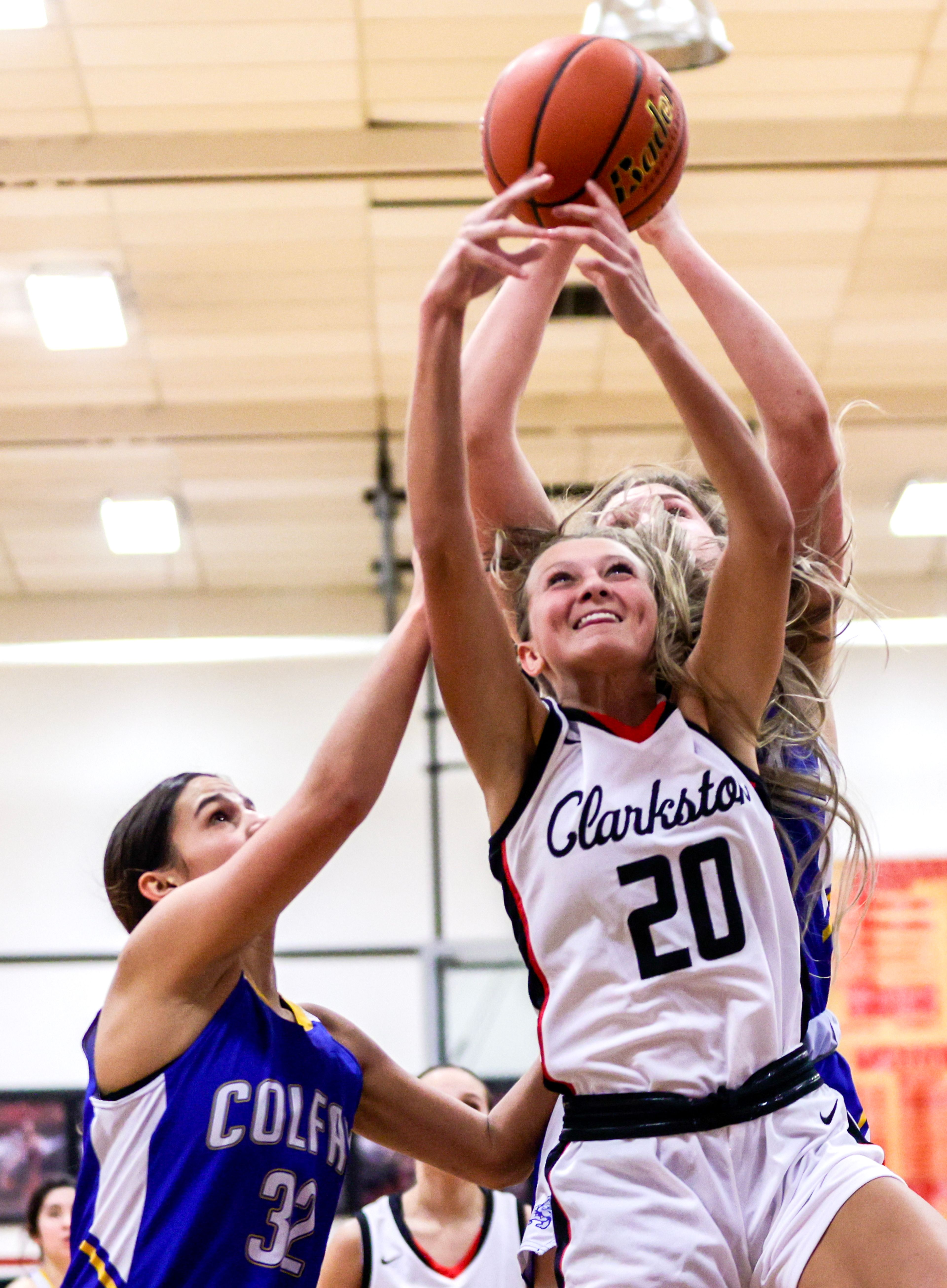 Clarkston wing Eloise Teasley grabs a rebound away from Colfax in a quarter of a nonleague game Thursday at Clarkston.