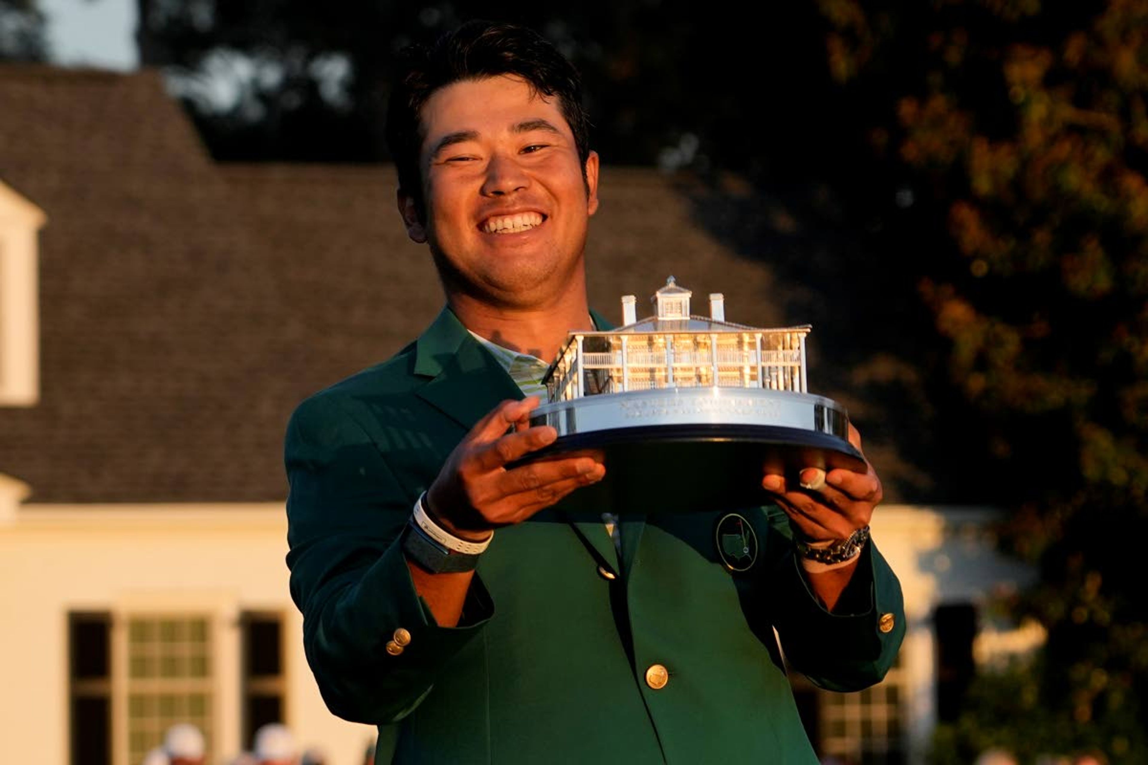 Hideki Matsuyama, of Japan, holds the trophy after winning the Masters golf tournament on Sunday, April 11, 2021, in Augusta, Ga. (AP Photo/David J. Phillip)