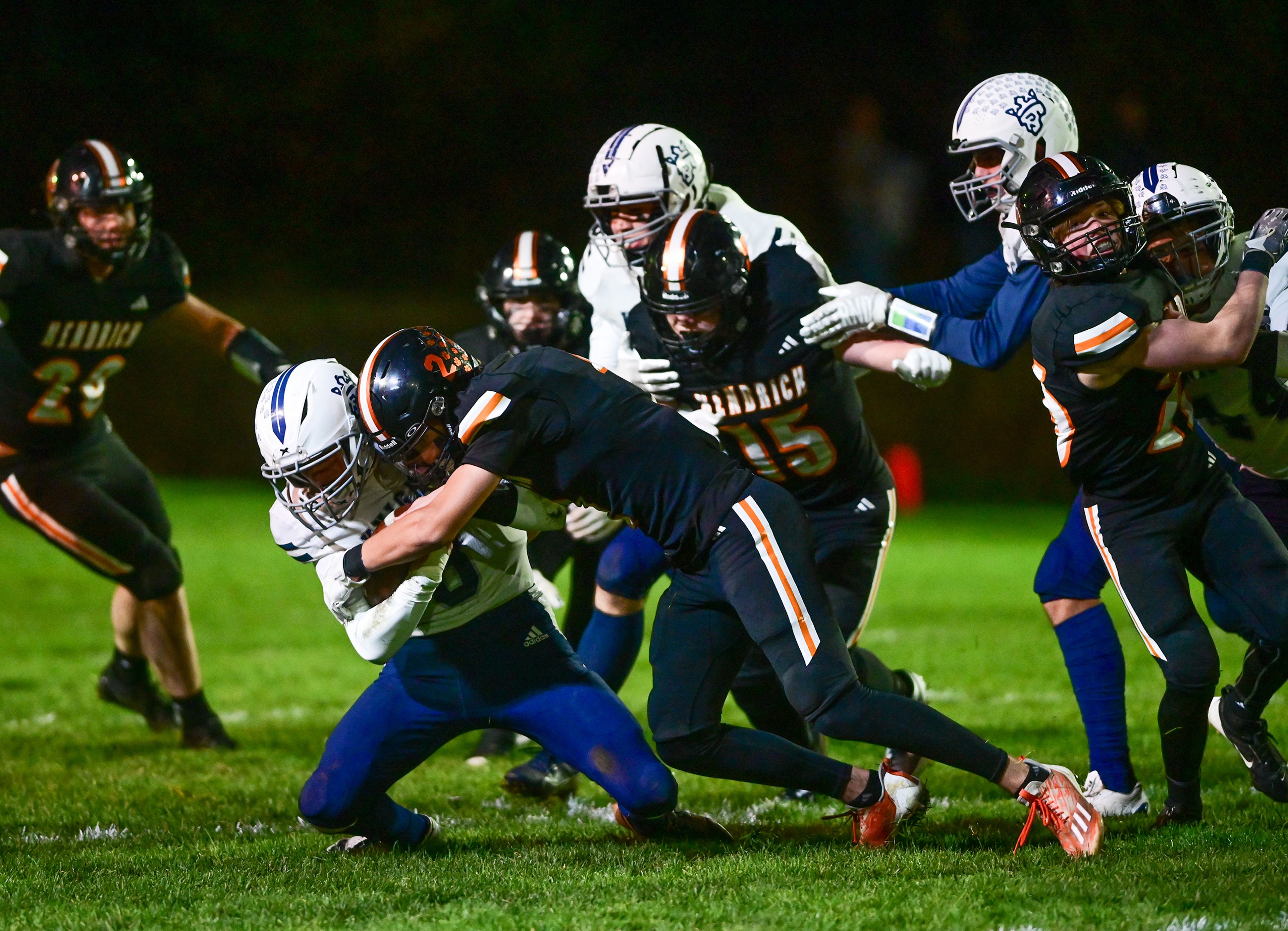 Logos Seamus Wilson is tackled by Kendricks Ralli Roetcisoender Friday in Kendrick.,