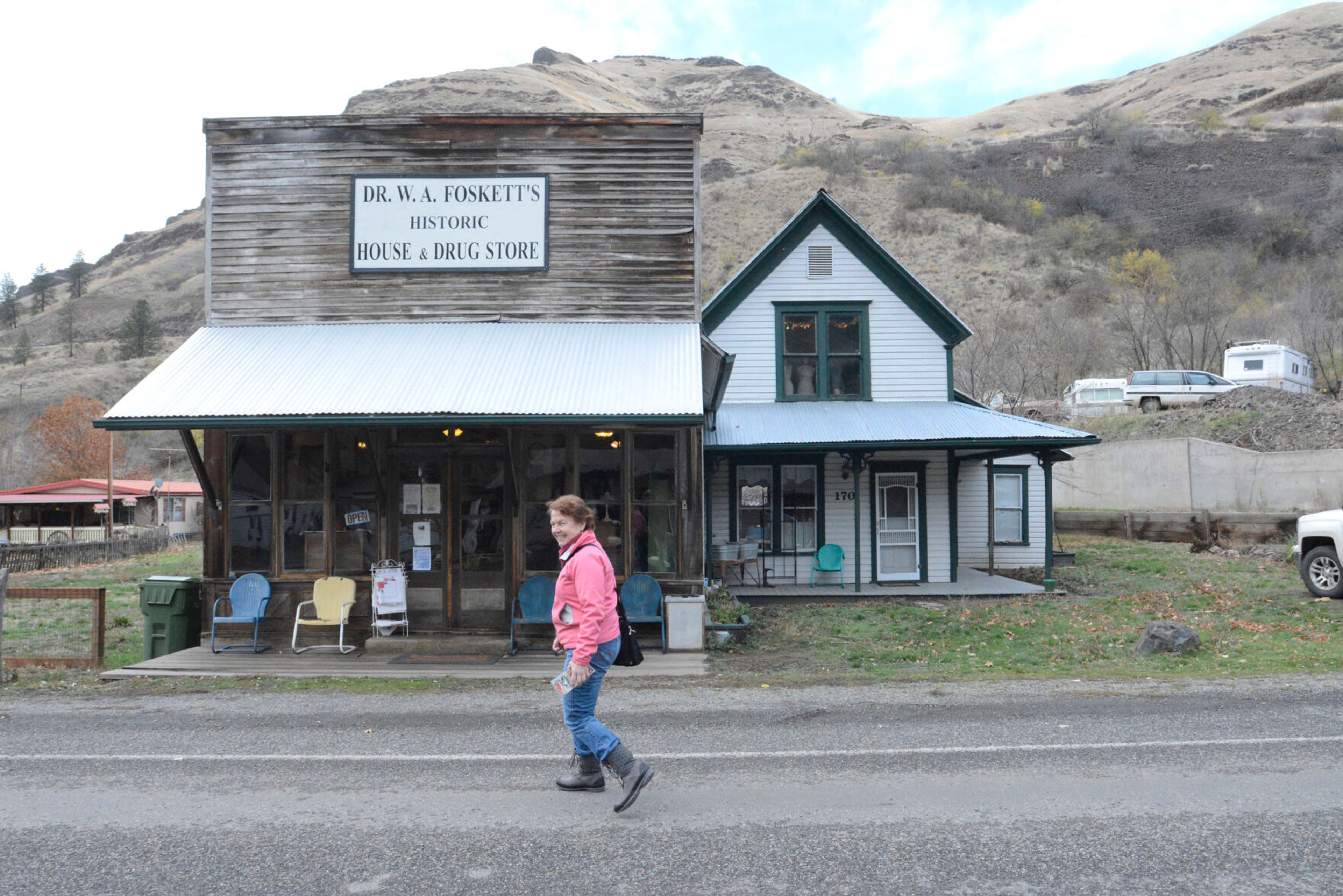 Kathy Hedberg crosses the street in White Bird, near the Historic Dr. Wilson Foskett Home and Drugstore.