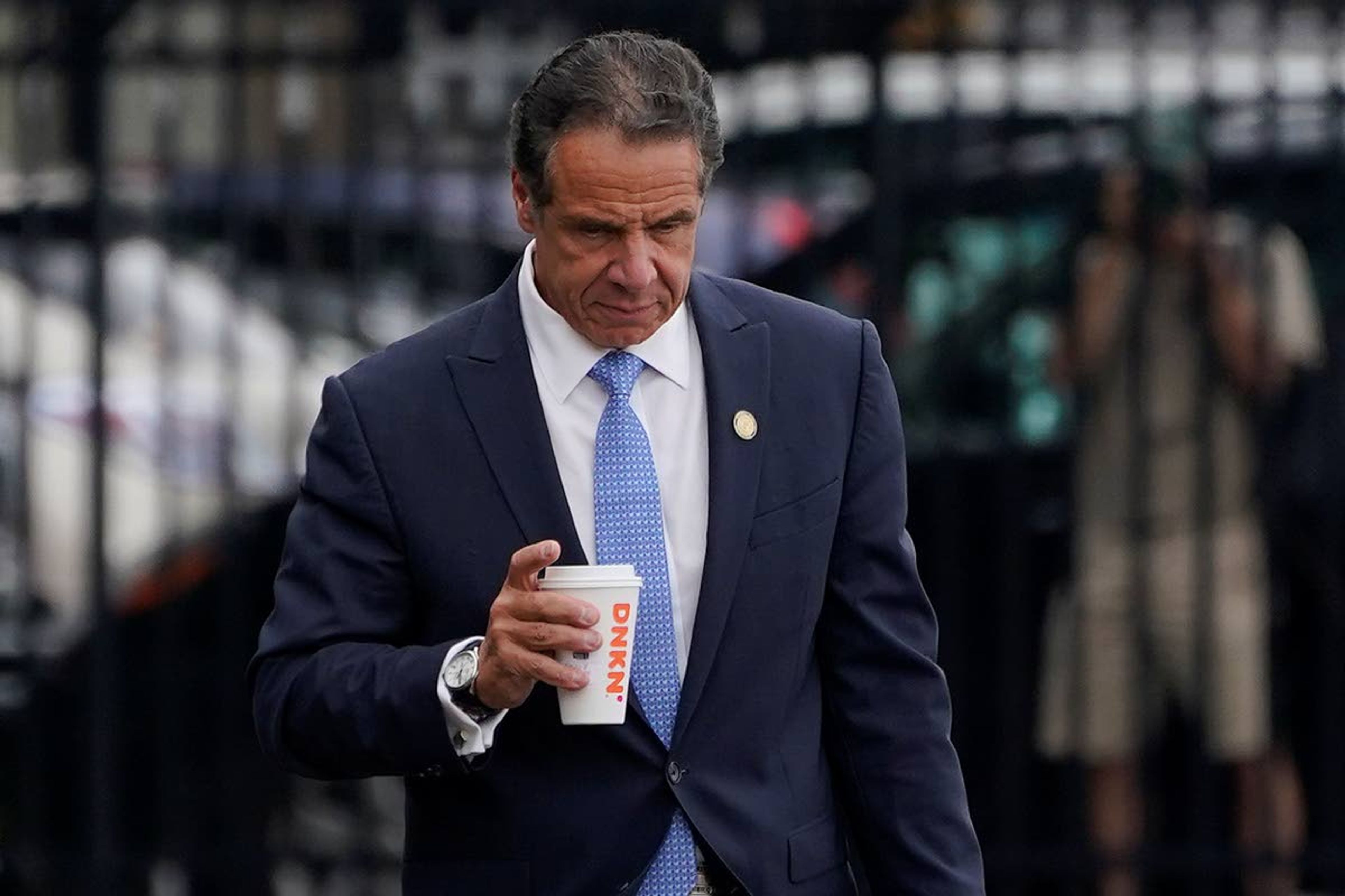 New York Gov. Andrew Cuomo prepares to board a helicopter after announcing his resignation, Tuesday, Aug. 10, 2021, in New York. Cuomo says he will resign over a barrage of sexual harassment allegations. The three-term Democratic governor's decision, which will take effect in two weeks, was announced Tuesday as momentum built in the Legislature to remove him by impeachment. (AP Photo/Seth Wenig)