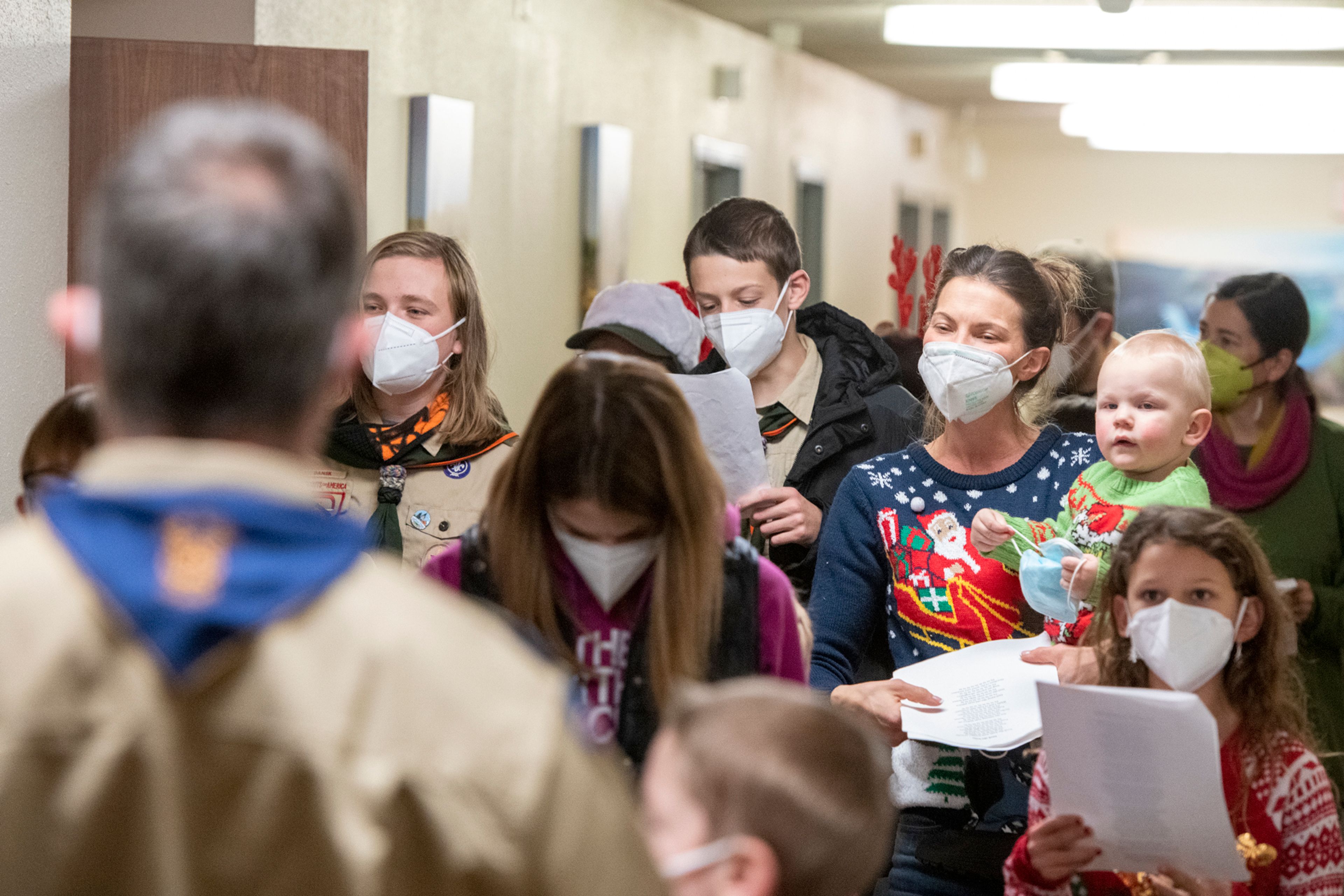 Boy Scout members of Troop 345 and Pack 323 sing Christmas carols up and down the hallway at Aspen Park of Cascadia in Moscow on Wednesday.