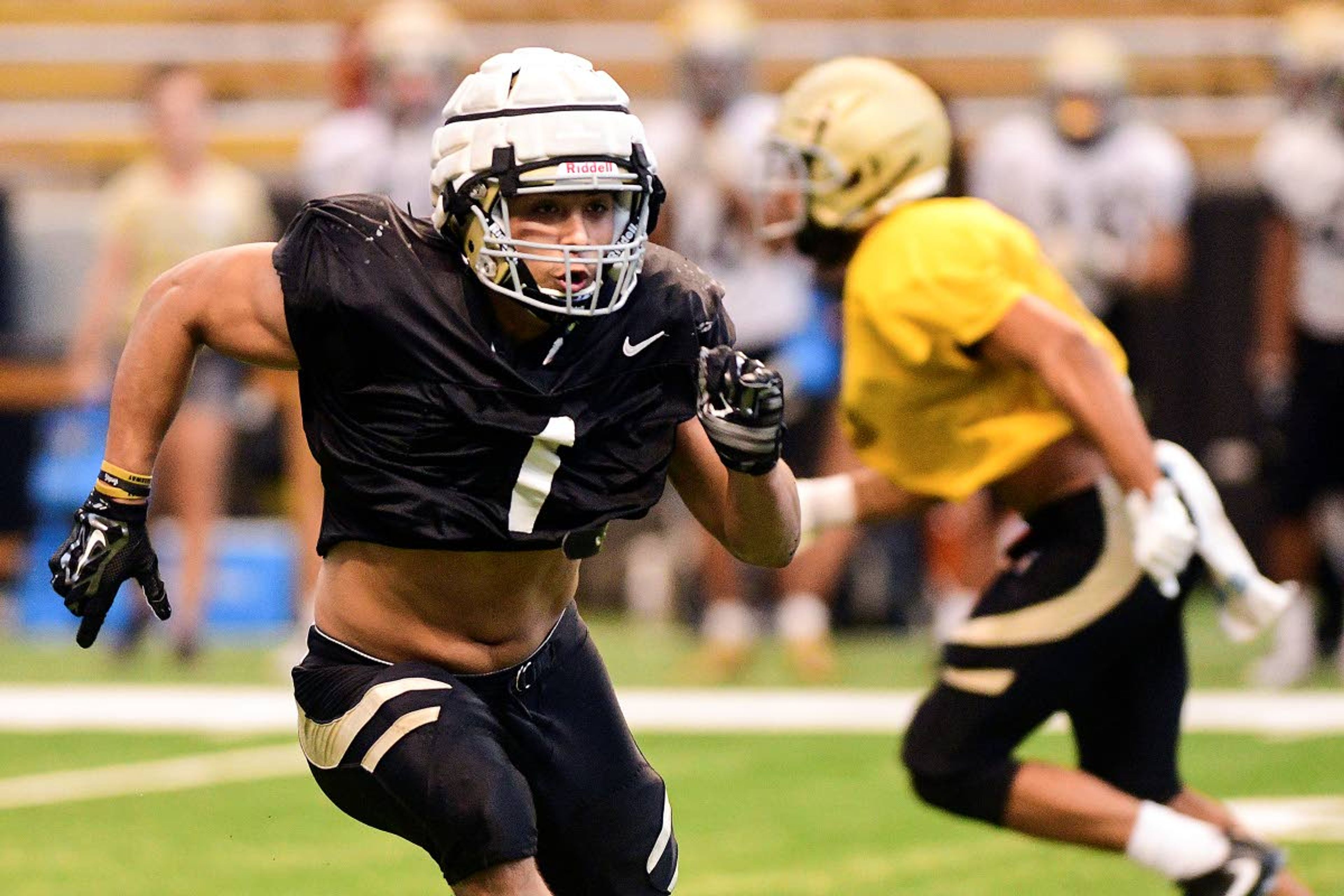 Idaho linebacker Christian Elliss (1) rushes toward the quarterback during a scrimmage Aug. 10 at the Kibbie Dome.