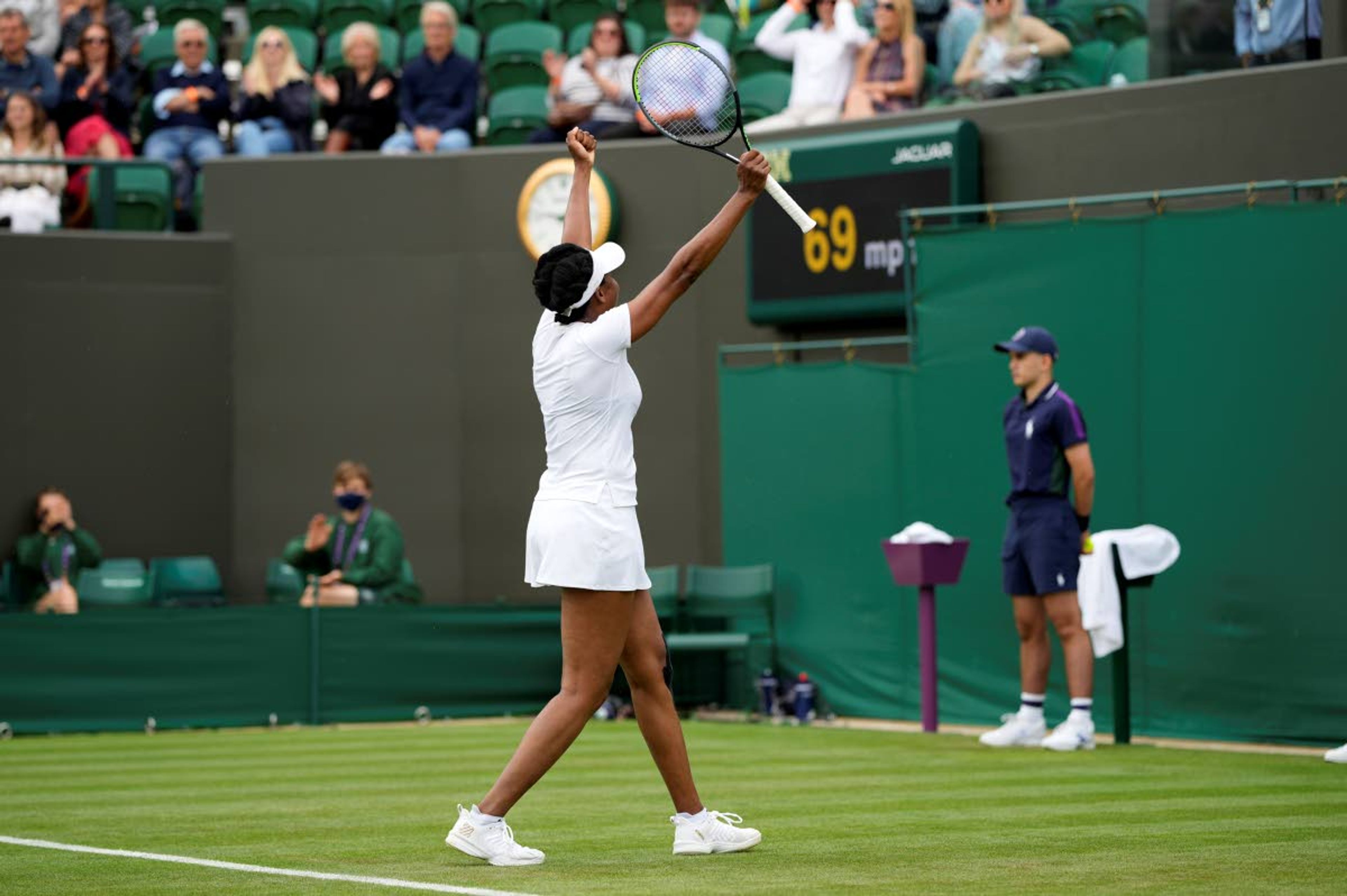 Venus Williams of the US celebrates winning the women's singles first round match against Romania's Mihaela Buzarnescu on day two of the Wimbledon Tennis Championships in London, Tuesday June 29, 2021. (AP Photo/Alastair Grant)