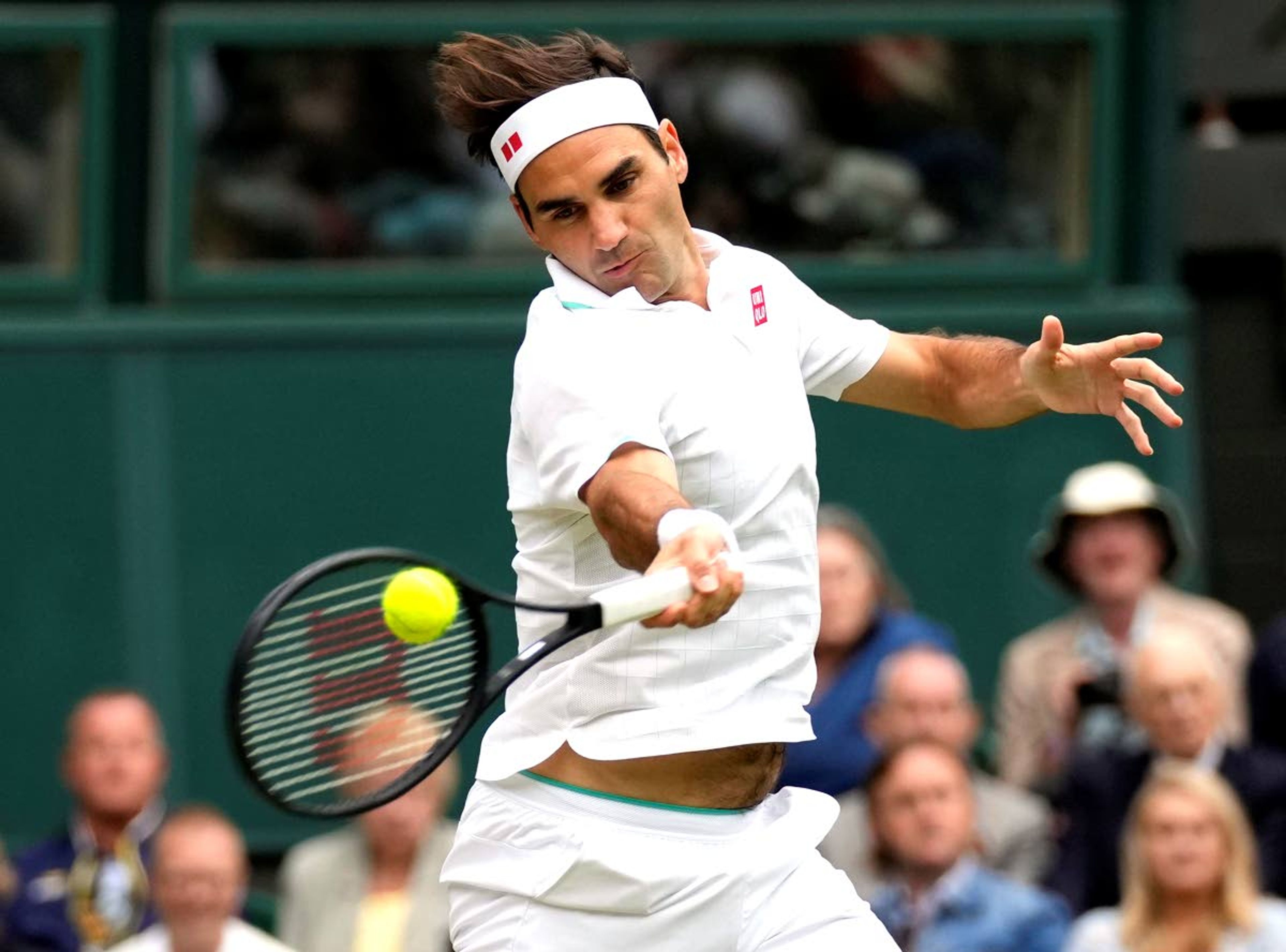 Switzerland’s Roger Federer returns the ball to Italy’s Lorenzo Sonego on Monday’s Day 7 of Wimbledon in London.