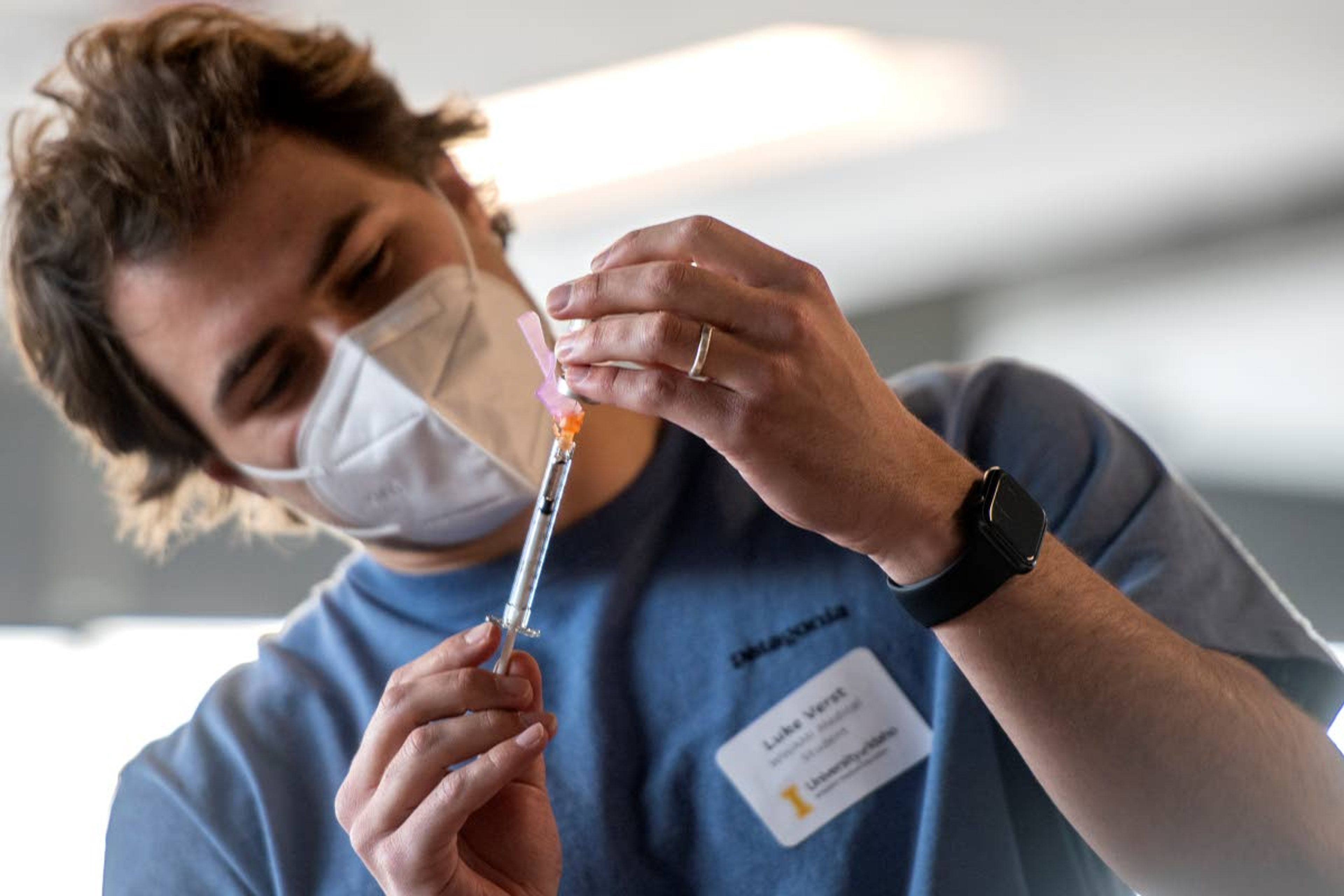 WWAMI medical student, Luke Verst, draws a needle as he practices administering doses of the COVID-19 vaccine at the University of Idaho WWAMI Anatomy Lab on Wednesday afternoon in Moscow.