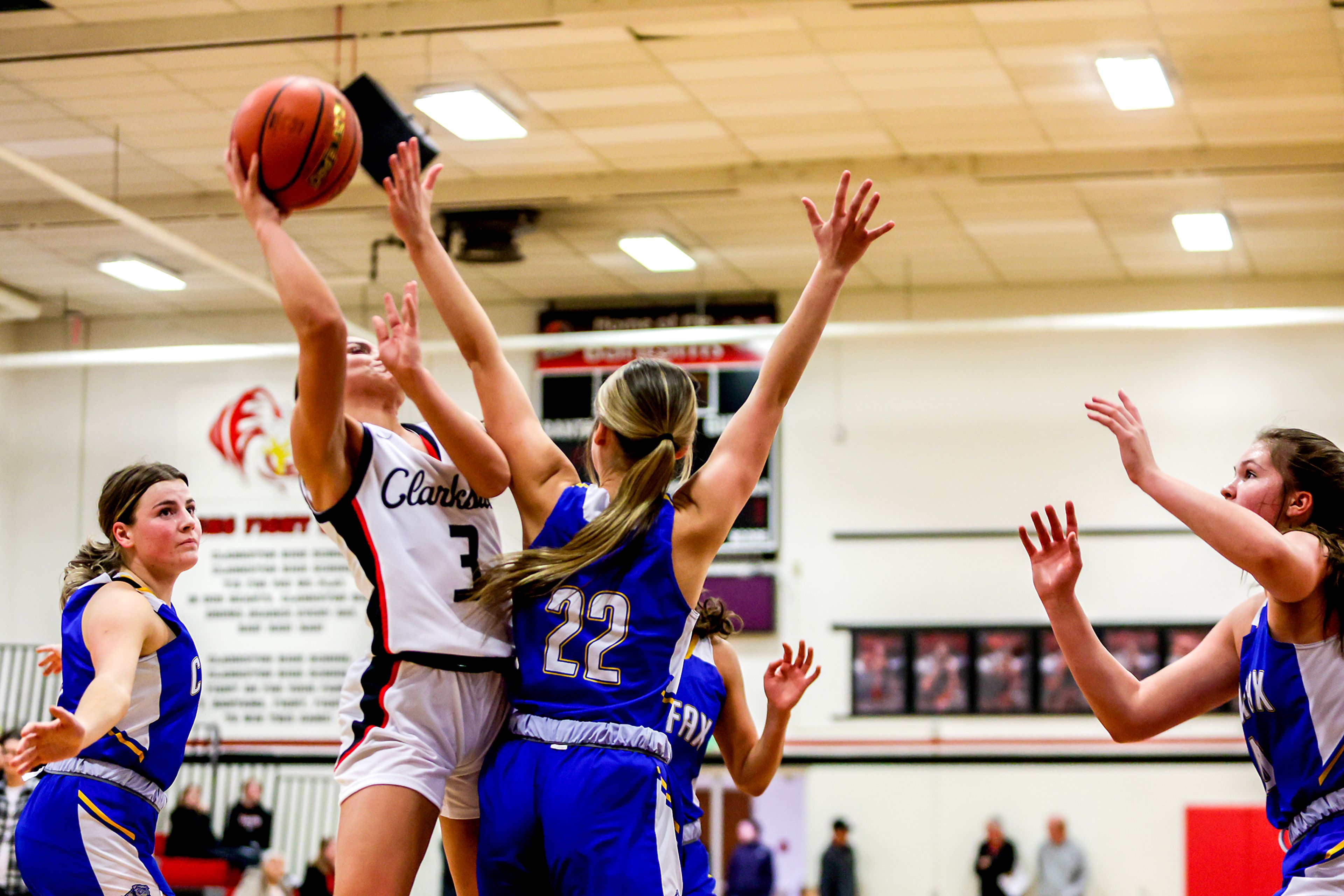 Clarkston guard Kendall Wallace takes a shot as Colfax guard Brenna Gilchrist guards her in a quarter of a nonleague game Thursday at Clarkston.