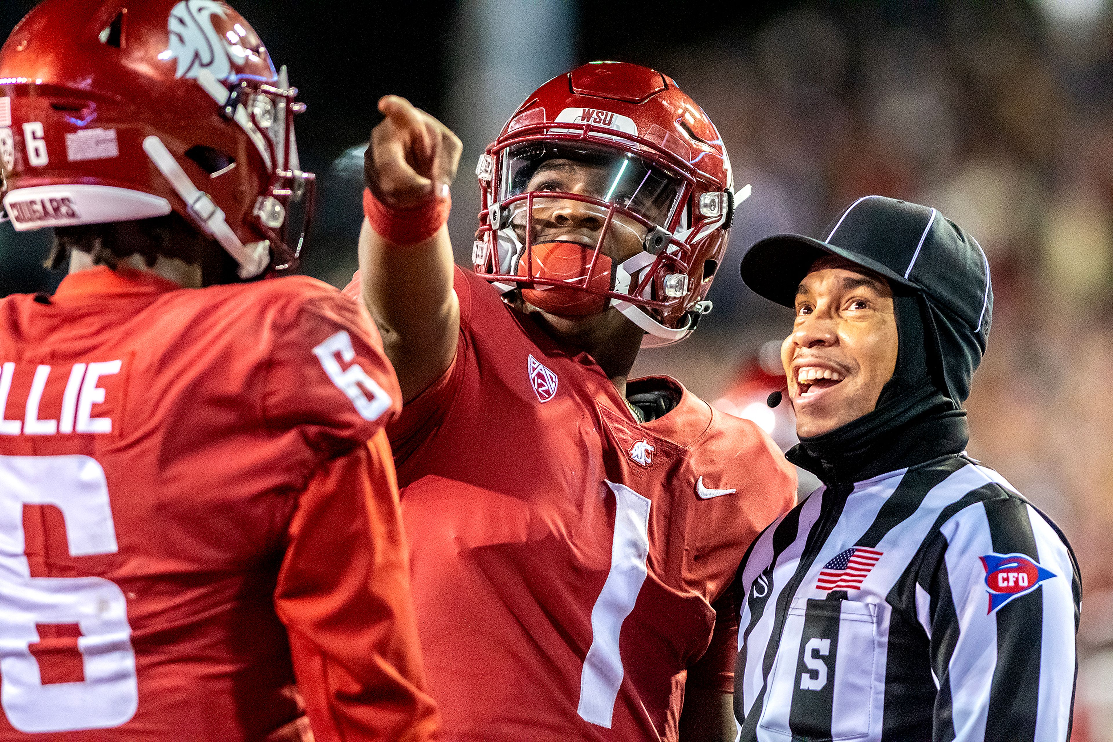 Washington State Cougars quarterback Cameron Ward (1) points towards the video replay after his attempt at two extra points was ruled no good at the Apple Cup on Gesa Field in Pullman on Saturday.