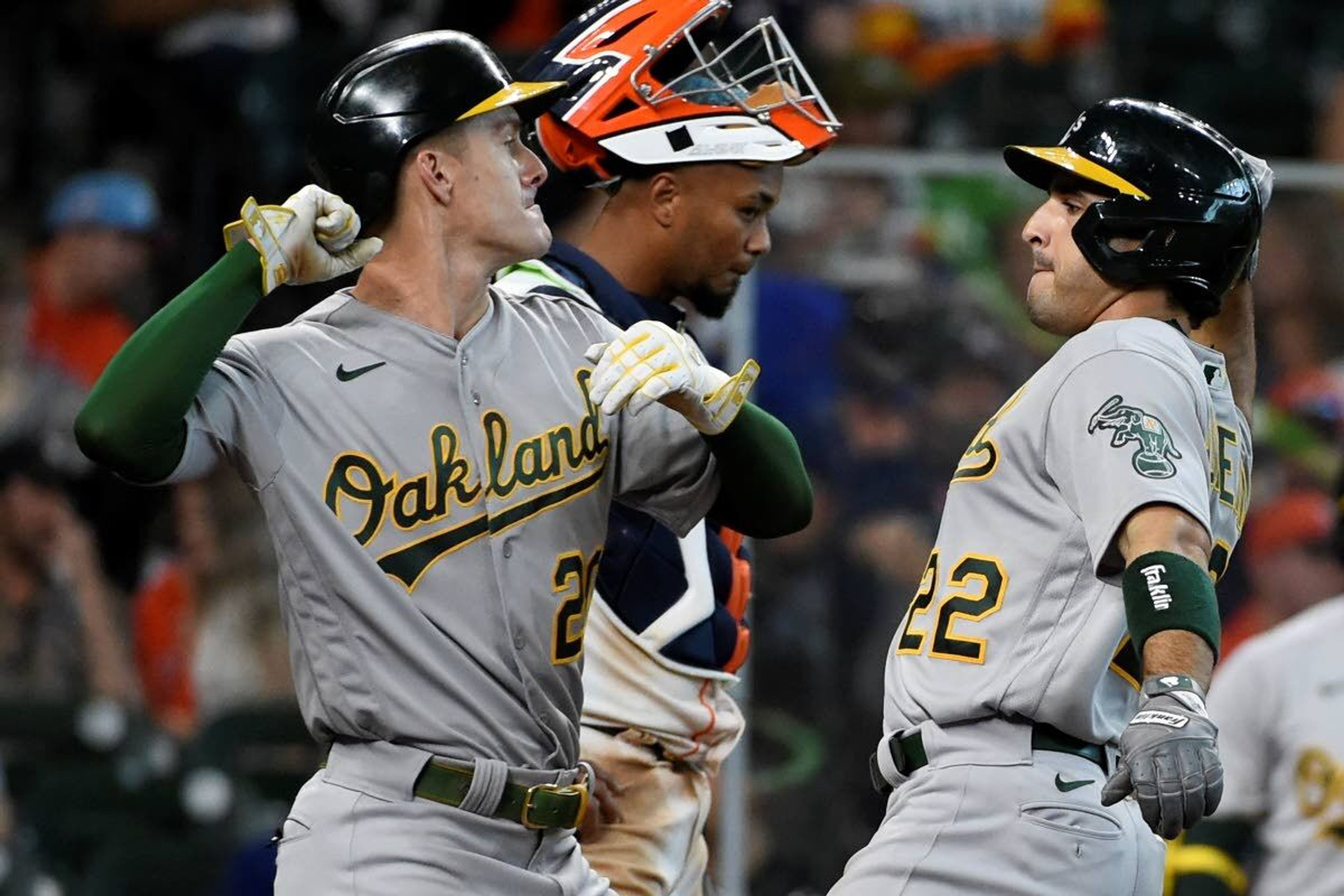 Oakland Athletics' Ramon Laureano, right, celebrates his two-run home run with Mark Canha during the fifth inning of a baseball game against the Houston Astros, Saturday, April 10, 2021, in Houston. (AP Photo/Eric Christian Smith)