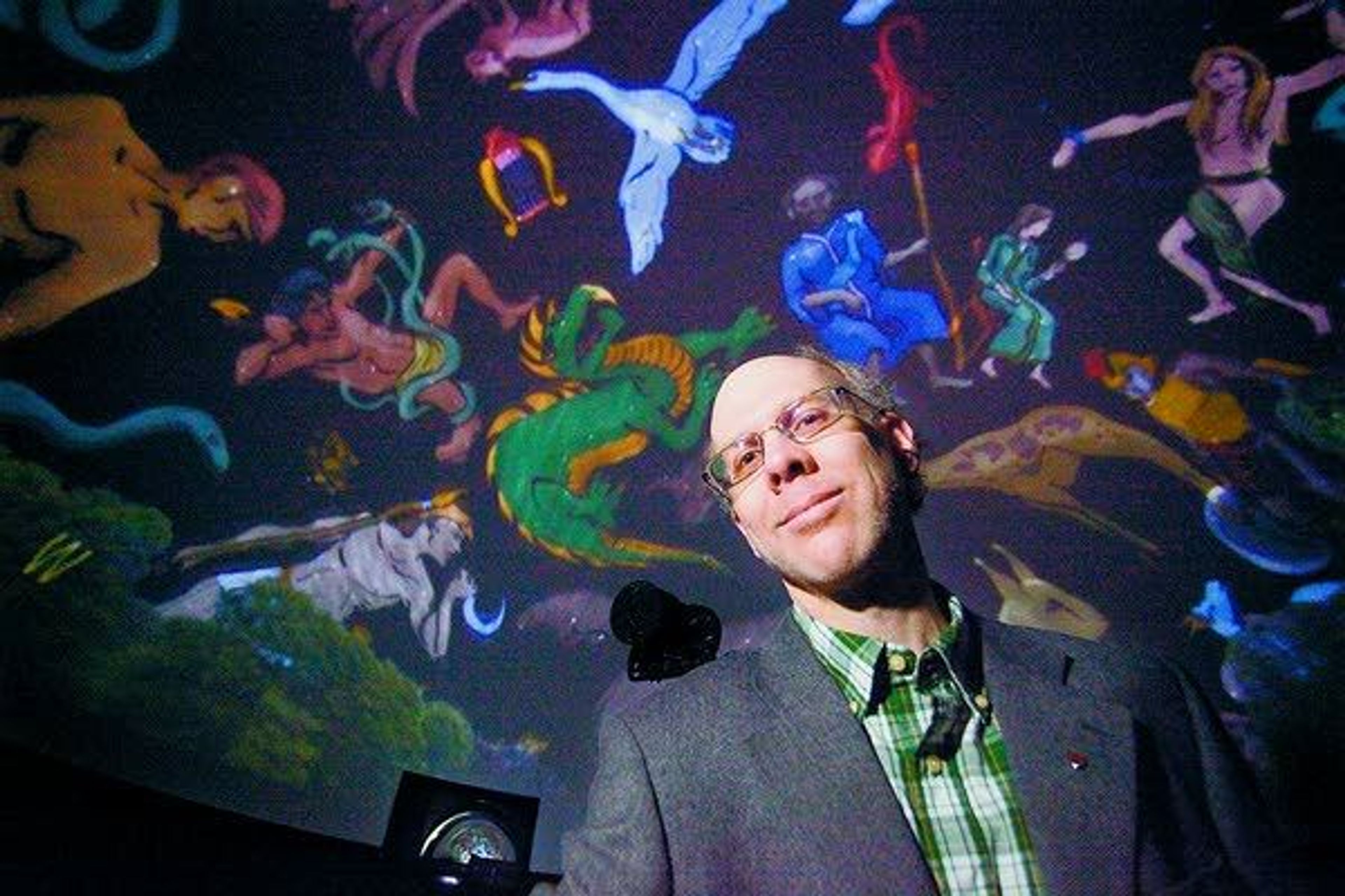 Senior Instructor Michael Allen works with the planetarium at Washington State University in Pullman. The planetarium is displaying the stars with the Greek and Roman constellations.