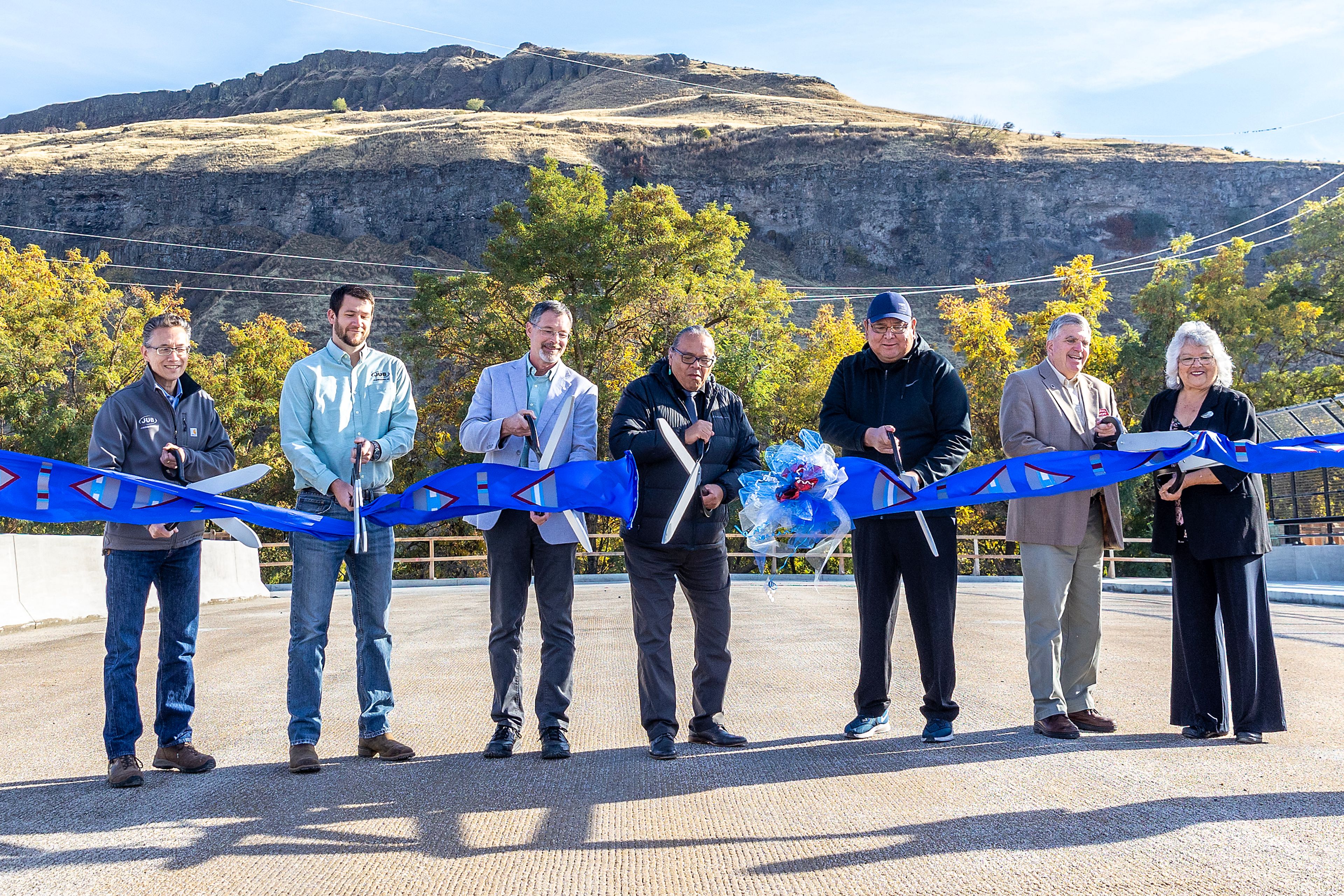 The design team cuts the ribbon Thursday for the Aht�Wy Interchange over U.S. Highway 95/12 in Lewiston.